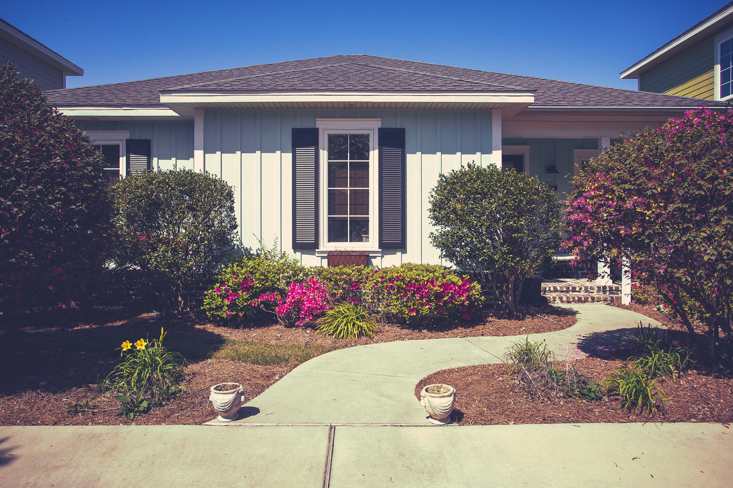 This thoughtfully designed HUFF Home evokes a calming sense of spaciousness and harmony. An abundance of natural light and tastefully chosen coastal hues create a soothing background for your personal treasures. Enjoying (3)spacious bedrooms & (2)full baths, this single-level paradise is lavishly appointed with 8' doors, crown molding, 9' ceilings, and elegant 18 porcelain tile. The stunning three-person kitchen boasts a plethora of all-wood custom cabinetry, stainless-steel appliances, granite counter tops with Italian stone backsplash and a generous sized pantry. The open and bright living/dining room area flows into a serene screened back porch overlooking a private garden & a coastal painted 8'ft fenced back yard. A sunny laundry room allows lots of room to work and stay organiz