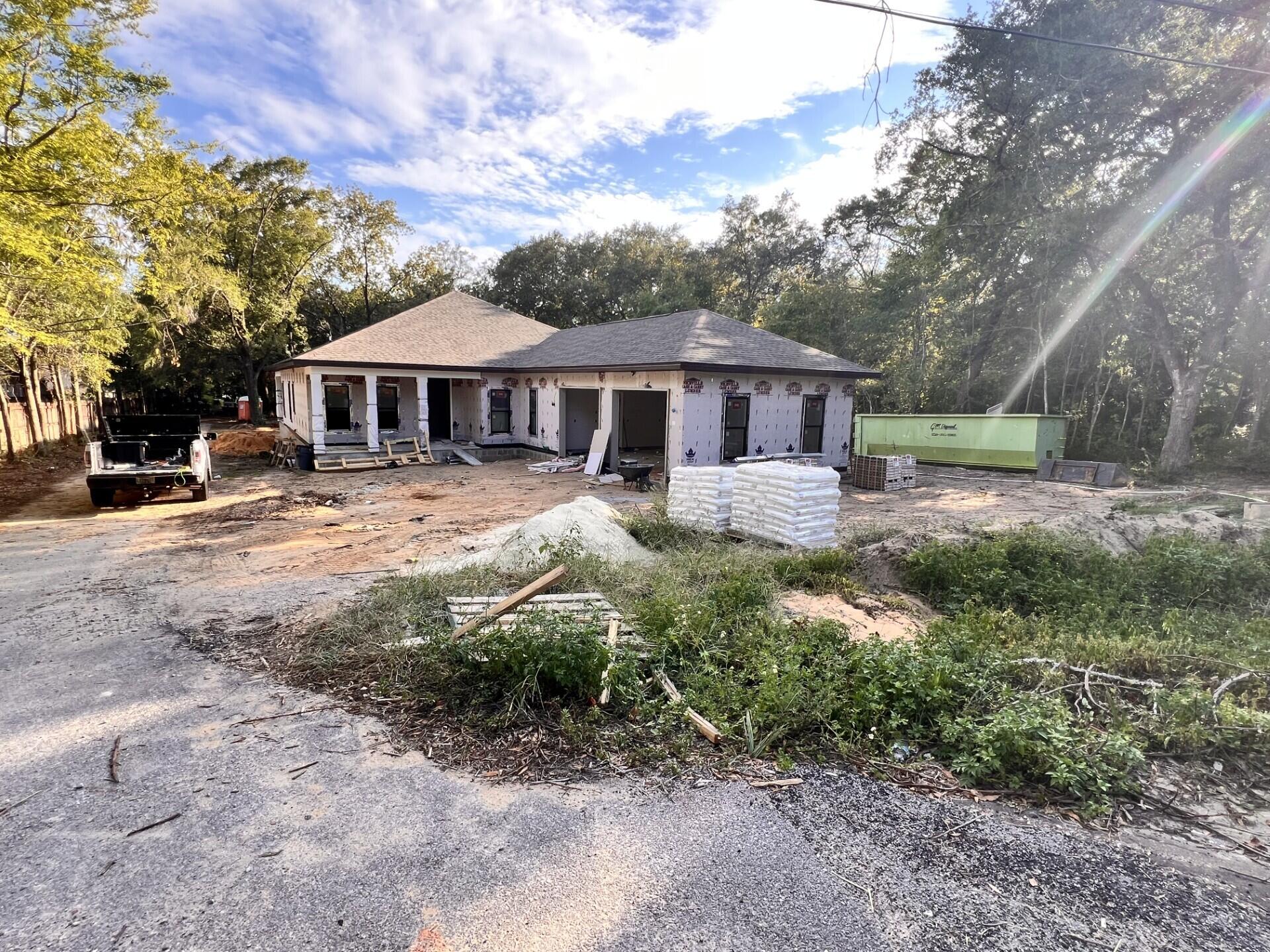 Come see this beautiful New Construction home nestled in the heart of Niceville. You'll absolutely love this 5 Bedroom and 3 full bath home. Enjoy the large lot, big enough for a pool, workshop and still have plenty of room for your pets. Entering the home through an 8ft door, you will be view 9 and 10 ft ceilings with reverse trey and rope lighting. You will love the luxury vinyl plank throughout and is easily maintained. As you continue through the foyer it opens up into a large family room with trey ceiling and rope lighting. The kitchen boasts white cabinets with soft close drawers and a beautiful cocoa colored oversize island/breakfast bar with bronze hardware. White quartz countertops throughout the home, including the laundry room. The master features a custom tile shower with a rainhead, top sprayer, bench and bench sprayer. For relaxation, you can step into a separate soaker tub. The gas tankless hot water heater makes it perfect, with endless hot water. Mirrors have led lighting with different colors that can be used or not. You have access from your master bedroom onto the very large screened in back porch. This home is made for entertaining. The yard will be sodded with a sprinkler system for easy maintenance. Location is everything and this neighborhood is convenient to the bases, beaches, hospitals, shopping and A+schools.
The builder will pay 7,500 towards buyers closing cost.
