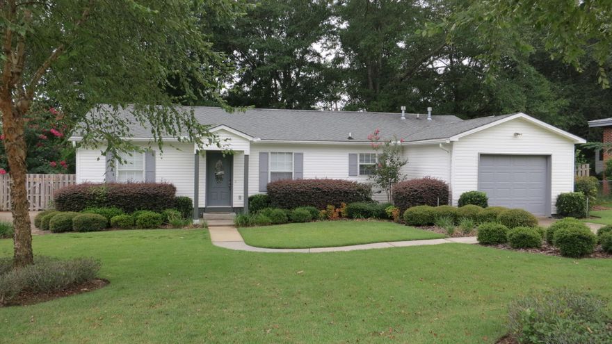 Charming and newer home built in 2005 conveniently located near Eglin AFB! This all vinyl, low maintenance home sits on a fabulous lot with large shade trees, and extra parking through a double wide gate in back for a boat, an RV, or any other ''grown up'' toys you may have. The large back-yard deck hosts a wonderful outdoor kitchen complete with built-in grill, sink and small refrigerator. Inside you will find an immaculate home with tile floors in living areas, kitchen & baths. The kitchen is open and spacious with a bar, stained wood cabinets and stainless appliances, and is open to the generous dining area, which opens to the nice family room. You have plenty of room for furniture and entertaining here! The split bedroom plan offers privacy with the master on the opposite side of the guest rooms.  The master bedroom hosts a large walk-in closet, and nice master bathroom.  The guest rooms share a hall bath and each have large wall closets.  The laundry room is just off of the kitchen.  This home is move-in ready!  Kids will love to play in the large back yard, completely fenced in and backs up to woods of Eglin.  There is a sprinkler system on a well to keep that yard beautiful all year.  Sellers are offering a 1 year home warranty.  This newer home in convenient Valparaiso will not be on the market long, so make your appointment to see it today! Buyer to verify all measurements important to them.