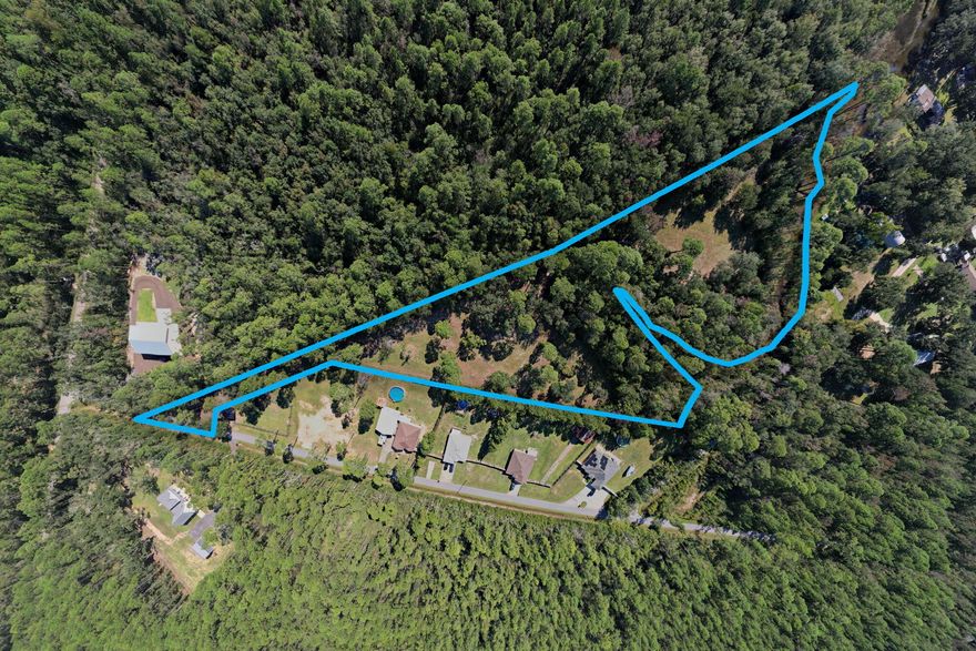 4.77 acres of land in beautiful Milton, FL! 396ft on Raccoon Bayou, this parcel is zoned for Residential building, making it the perfect place to build your dream home! Don't wait! Wetland Study and Survey available in MLS DOCS. NO Taps have been paid.