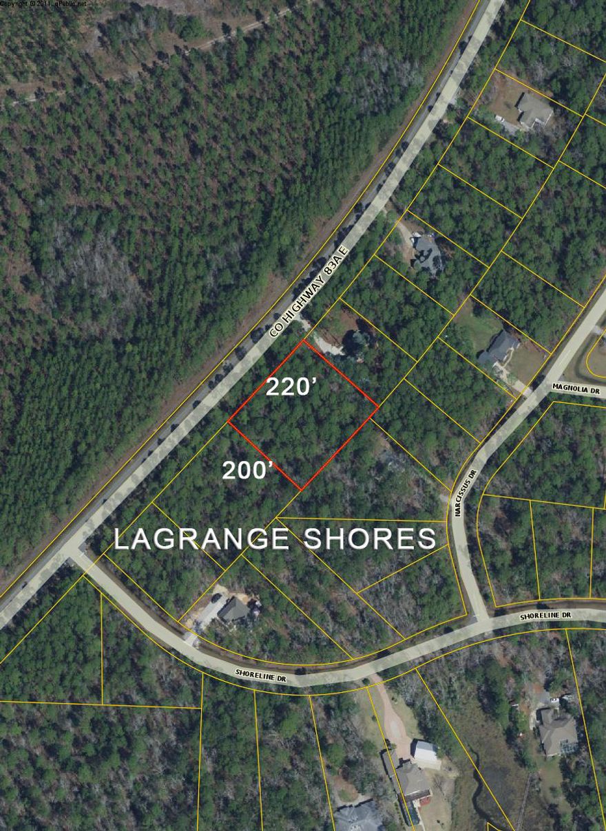 This is a beautifully wooded 1.1 acre lot located in LaGrange Shores Subdivision off of East Bay Loop Road in Freeport.