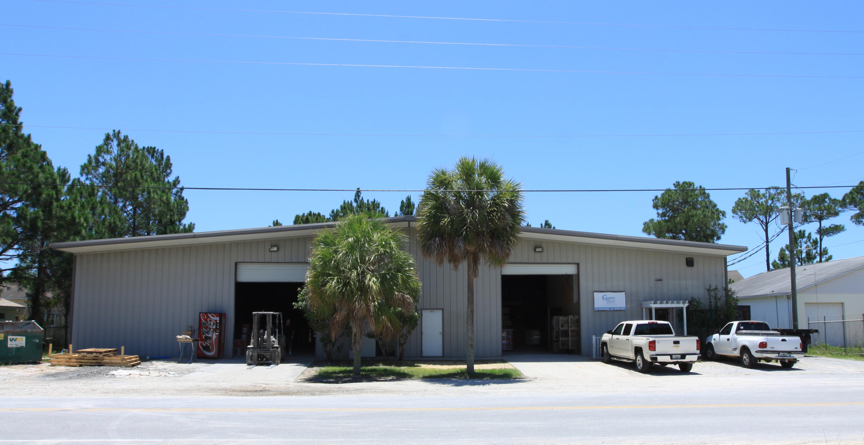 10,000 sq ft building with retail/office space in Miramar Beach available for lease. This property features two 12 ft roll up doors, office space, ample parking, and is currently divided into two units.