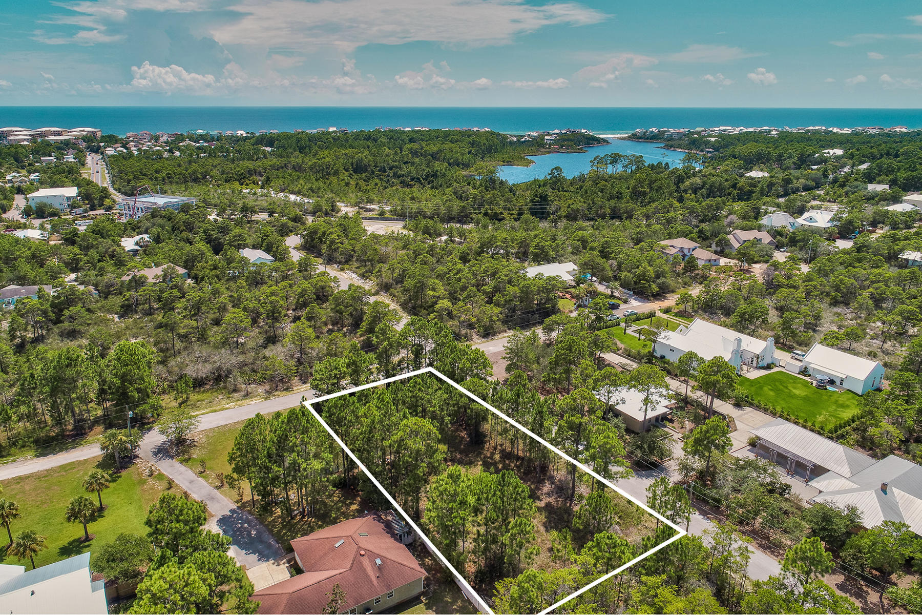This ​half acre corner lot sits in the quiet, established neighborhood of Pines of Blue Mountain. Plenty of room for a house, guest house and pool! The Hwy 30A neighborhood has access to the trails of Point Washington State Forest and is conveniently situated between Gulf Place and the Cafes and Shops at Redfish Village. No build out time​ makes it even more desirable. ​ Several beach accesses are within minutes, including two with full facilities, and the 18 mile jogging/bike path that runs along 30A is just a distance away.