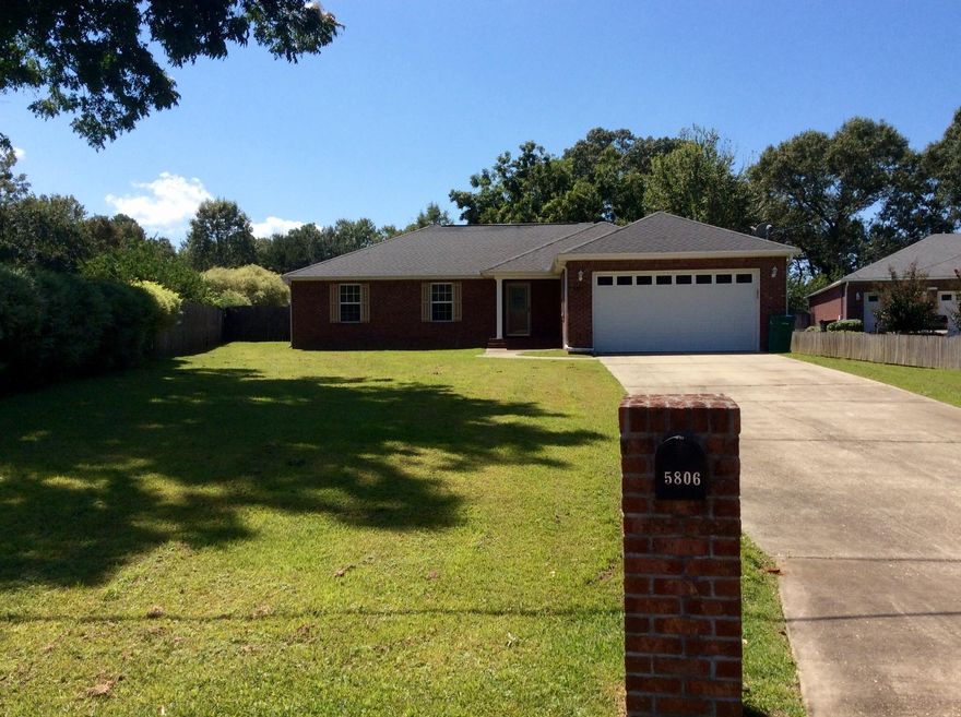 Awesome location! Only 1 mile from the new North Crestview Public Shopping center, close to schools and shopping and easy commute to Bob Sikes Airport and all area Military Bases. Located on a well manicured .56 acre lot with fenced backyard, workshop and mature pecan trees, and outdoor patio. Plenty of room for a pool, NO HOA! this 4 bedroom 2 bath home features all brick construction, wood laminate flooring in the living area and hall, vaulted ceiling in living room, large master with tray ceiling and master bath with corner garden tub, separate shower and double sinks. The split bedroom plan is functional and the home gets lots of natural light. If you want an affordable home built to the upgraded hurricane codes in an area without an HOA this is a must see!