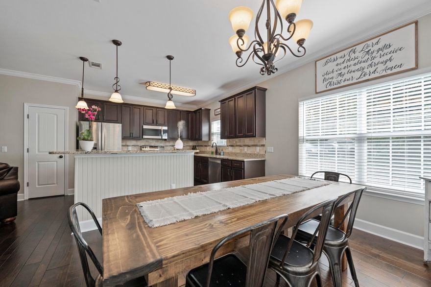 LOW Maintenance living in Niceville.  HOA covers lawn maintenance of the front and back yard and sprinkler system!  Built on the largest lot in the neighborhood, this 4 bedroom, 2.5 bath home features upgraded hardwood floors, stainless steel, granite on all surfaces, double vanities in both full baths and lots more!  The open floor plan is casual and inviting!  The perfect space for any large gathering.  You will also appreciate the large laundry room, located near the bedrooms, with extra cabinets and a utility sink.  The back deck is completely screened and has a covered patio space with fans.  Enjoy the neighborhood gazebo or Turkey Creek Nature Trail that is practically next door!  Current Terminix termite bond too.  Less than 3 miles to Eglin AFB and just 14 miles to Destin.