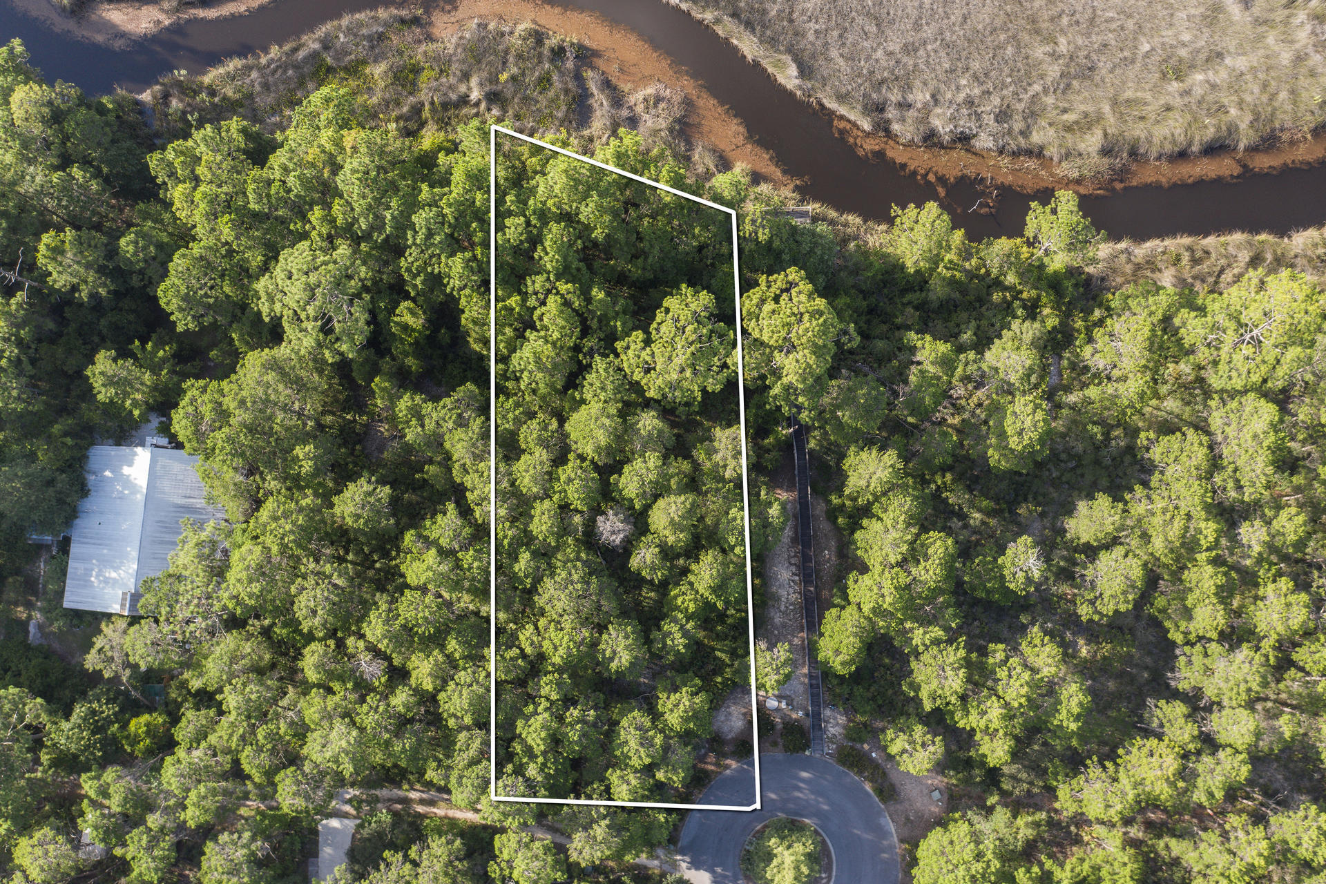 Launch out of your own back yard & navigate the waters of Lake Powell! When the time is right you can even find your way to the Gulf! This stunning waterfront homesite is ready for you to create your perfect dream home. No HOA! NO build out time! And perfectly located!The Approved & Soon to be Built -98 UNDER PASS- will be located at the end of the street! Making that less than 1mile travel to the world famous beaches, a breeze!PLUS, just a 1 min golf cart ride can bring you right to the premier 30Avenue! Known as 'The gateway to 30A'', this premier venue offers incredible fine dining, concert series, elite beauty and lifestyle shopping! Rosemary Beach, Alys Beach and ALL that 30a offers are within minutes from this unbeatable lot. This is THE lot!!