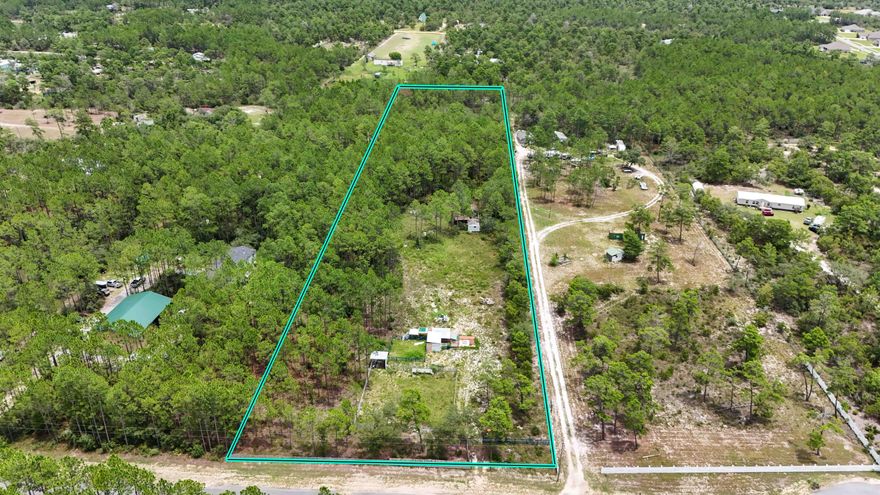 Prime opportunity to own nearly 5 acres in the growing community of Freeport. This expansive property offers the tranquility of country living, and ideal for those envisioning a dream home with ample space to roam, this stunning parcel awaits you! The partially cleared land offers two horse corrals, a large, covered deck, and 2 small sheds. Situated in an X flood zone, it presents limitless possibilities without the need for flood insurance.  Plus, it's conveniently located near some of the world's most exquisite beaches, ensuring both privacy and proximity to coastal beauty. No HOA!!