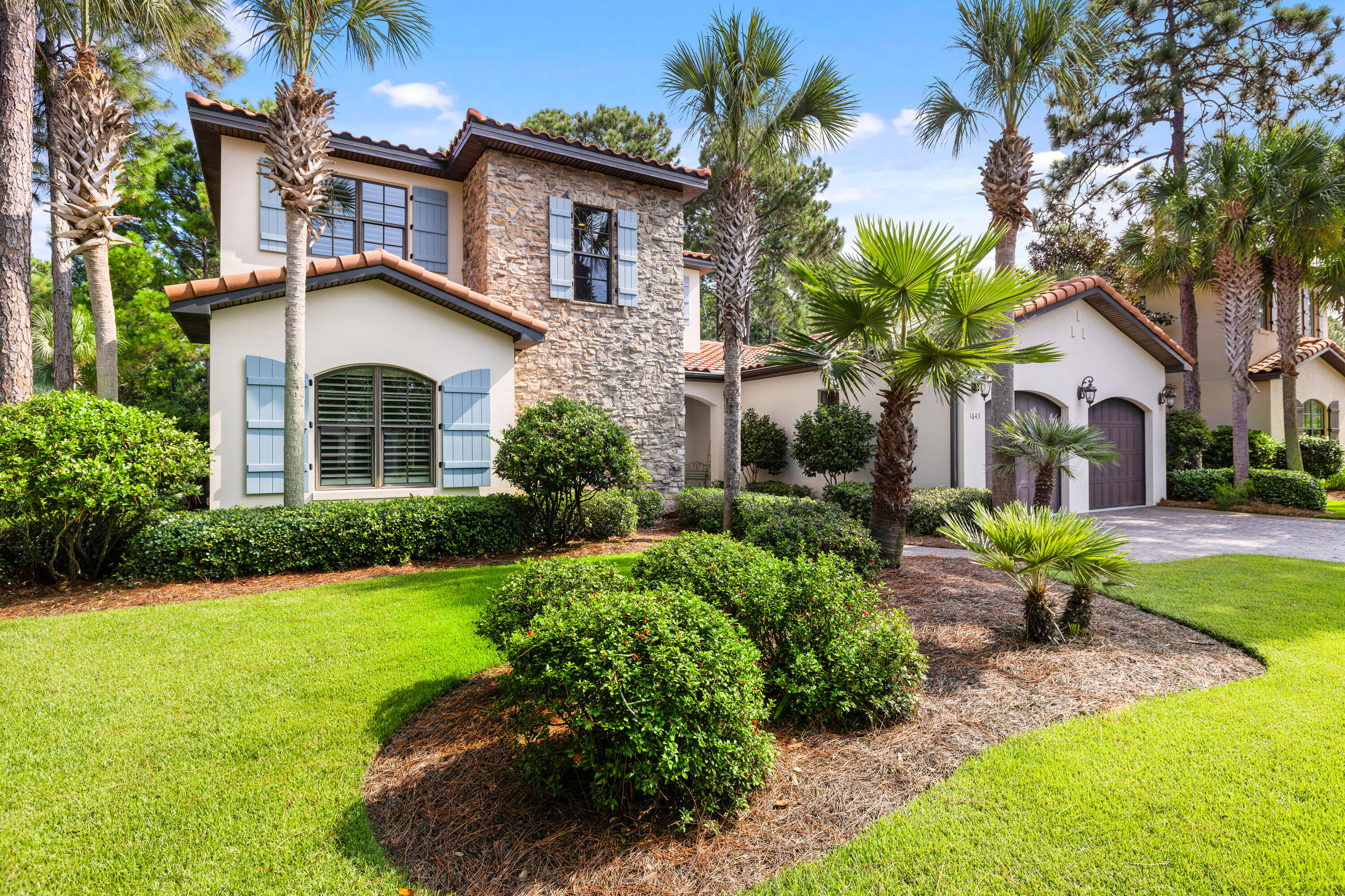 Lakefront Luxury! Discover this beautifully maintained 4BR & 4.5BA Tuscan-style home located in the sought-after Genoa community within Sandestin located on a serene lake, offering lush landscaping and exceptional privacy. The expansive patio, complete with a cozy outdoor fireplace and built-in grill is perfect for alfresco dining or gathering with friends and family. The generous lot is impeccably landscaped and offers the potential to add a private pool, enhancing your outdoor oasis. Inside features an open-concept design providing a seamless flow throughout. The Master Suite and a Guest Suite are located on the main level, 2 additional Guest Suites and a Spacious Bonus room are located upstairs. Updates include NEWLY installed HVAC, Hot water heater, and Freshly painted exterior! Arrow maintains home pest control for both quarterly service and includes Sentricon Termite System, home and a transferrable termite repair bond.