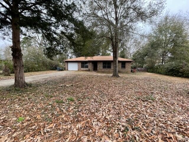 Buyers Financing fell through! 3 BDRM BRICK HOME IN CRESTVIEW! NEW ROOF in 2021. Tile floors throughout the main living areas, kitchen, hall, and master bedroom. The kitchen features beautiful blue cabinets with updated hardware, stone accent wall and updated appliances. Two bedrooms are carpeted. Large back yard recently cleared, includes fence and a wide gate. Plenty of room to store a boat or RV and the home also includes a single car garage! Gorgeous azaleas line the border providing a natural screening. Showings begin SUNDAY 2/20/22. Call for an appointment! Home is occupied.