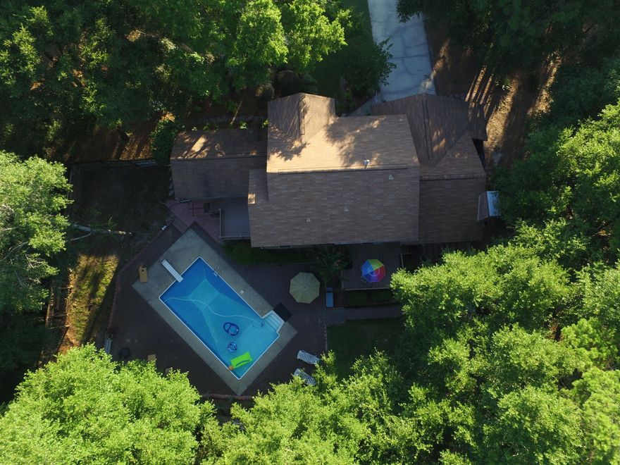 CHARMING HOME ON CORNER LOT IN ROCKY BAYOU! LARGE TREES & LUSH LANDSCAPING SURROUNDS THIS BEAUTIFUL HOME SITE. YOU'LL ENJOY ALL THE SPACE THE KITCHEN OFFERS W/ AMPLE CABINETS, COUNTER SPACE, & DOUBLE PANTRY. IT'S ACCENTED W/ GRANITE COUNTER TOPS, DAZZLING BACKSPLASH, STAINLESS STEEL APPLIANCES & KITCHEN ISLAND W/ BREAKFAST BAR. SLIDING GLASS DOORS LEAD OUT TO ONE DECK FROM BREAKFAST AREA ALSO MAKING IT BRIGHT AND CHEERFUL. OTHER NICE FEATURES INCLUDE 2 MASTER BEDROOMS, 2 AC UNITS (MAIN UNIT REPLACED IN DEC 2015) 2 WATER HEATERS, OVERSIZED GARAGE THAT MEASURES 29x22 WHEN 2 ALCOVES ARE INCLUDED AND IN-GROUND POOL. DOWNSTAIRS MASTER BEDROOM HAS SEPARATE HEAT/AC AND WATER HEATER. ACCESS TO GOLF COURSE IS AT END OF THE STREET. ALL MEASUREMENTS & DIMENSIONS ARE APPROXIMATE, BUYER TO VERIF