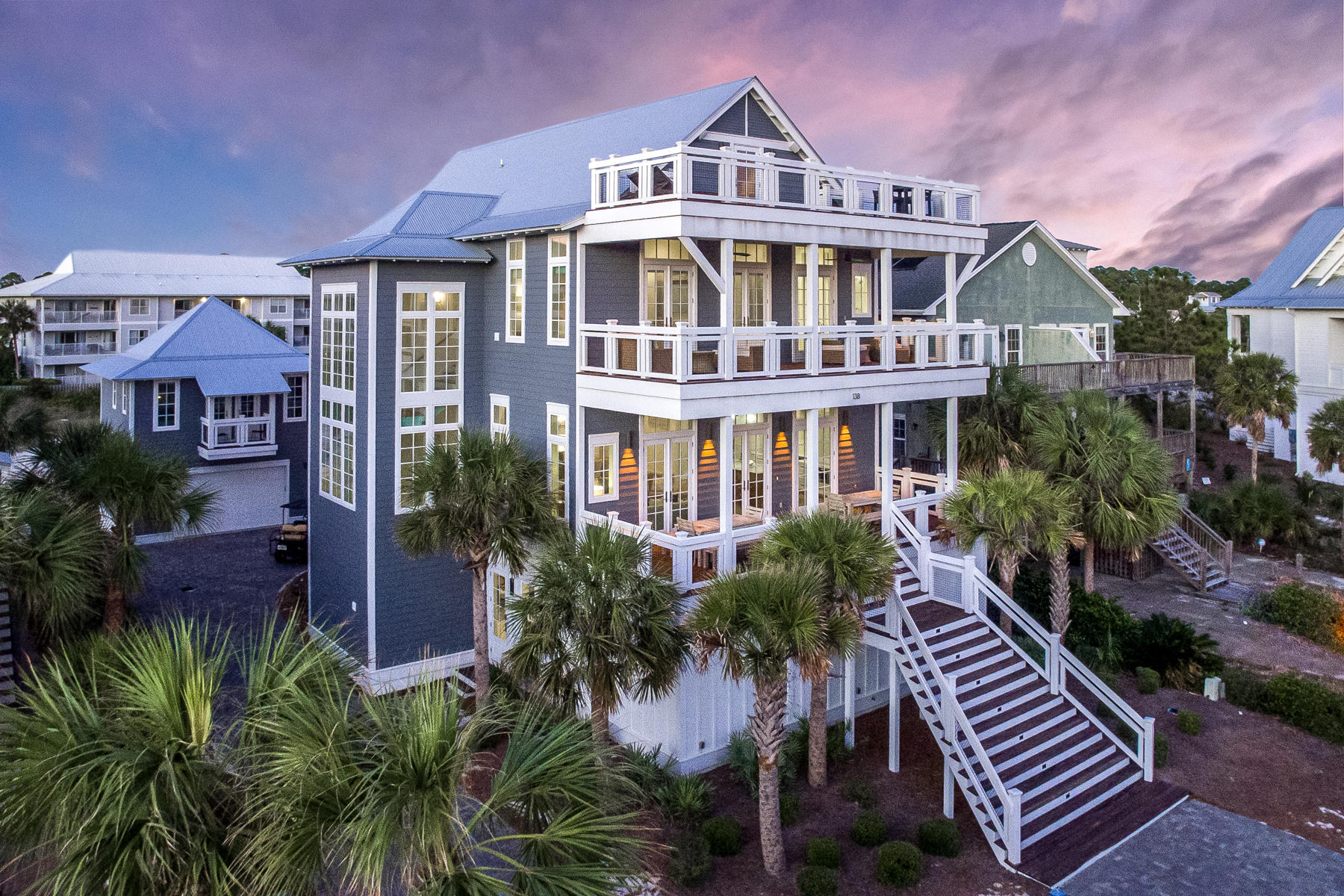 Take your morning coffee to a new level, Sea Level! An era defining estate sized beach house, this dazzling beach retreat offers every possible amenity with plenty of room for friends...36 friends!  This 9 bedroom, 4 story home offers sweeping views of the Gulf of Mexico with terraces from every floor to lounge the day away. The easy living floor plan starts on level I.  Two large bunkrooms designed to each sleep eight, both outfitted with personal TV's in each bunk and ensuite baths, open to a cozy living room flanked with a side game room for a game of pool or air hockey.  Sliding glass doors open to a grand scale outdoor terrace, summer kitchen, living room with flat screen TV and a salt-water, heated pool and spa that features a TV to watch while you float the day away in the pool.