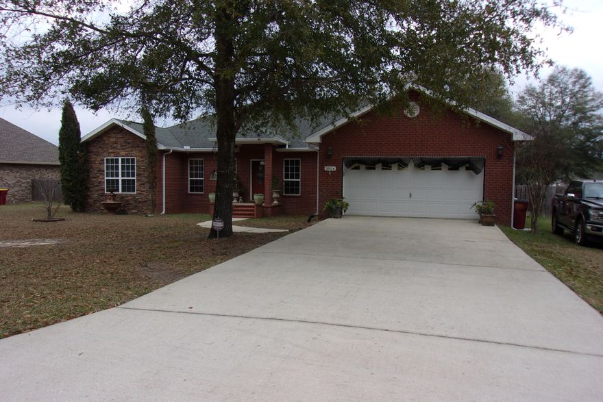 Immaculate 4 Bedroom/ 3 bath home on 1/2 acre ready for you to move in.   Conveniently located near Duke/ 7th Special Forces, Crestview & Defuniak Springs.   This home offers a lot. Split floorplan with 2 ensuites, kitchen with gas stove top, dbl. electric oven with one being a convection oven & self cleaning. Master Bedroom LPV floors, walk in closets in Master Bath.  2 bedrooms with carpeting, Huge living room with fireplace.   Security cameras.  AC system with a halo unit included.   Full privacy fence in the back yard with a double gate on one side and a single gate on the other.  Yard building & 12x20 shed with electricity & lean to.  Gas line to grill in for grilling out - schedule your personal showing today. Sprinkler system, screened back porch. Granite counter tops.