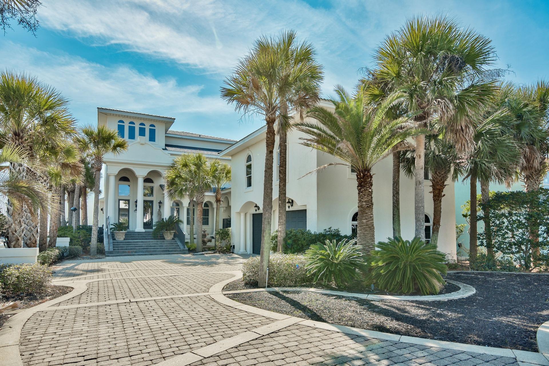 The Bellagio' is a luxurious property located on the beautiful beaches of scenic highway 98 in Destin, FL. This home offers unparalleled views from all three floors, and a large private pool directly off the first floor living, dining, kitchen areas perfect for sunset viewing. The moment you turn onto the driveway at this property in Destin, you are welcomed with it's large paved driveway lined with palm trees, tall columns, and elegant Mediterranean-style with immaculate craftsmanship.This spacious plan boasts over 6,207 square feet, including 8 bedrooms, 7.5 baths, and a spacious carriage home connected through the courtyard. Currently on the rental market, The Bellagio' is a thriving vacation rental, perfect for all occasions, and is located just five minutes from the Destin Commo