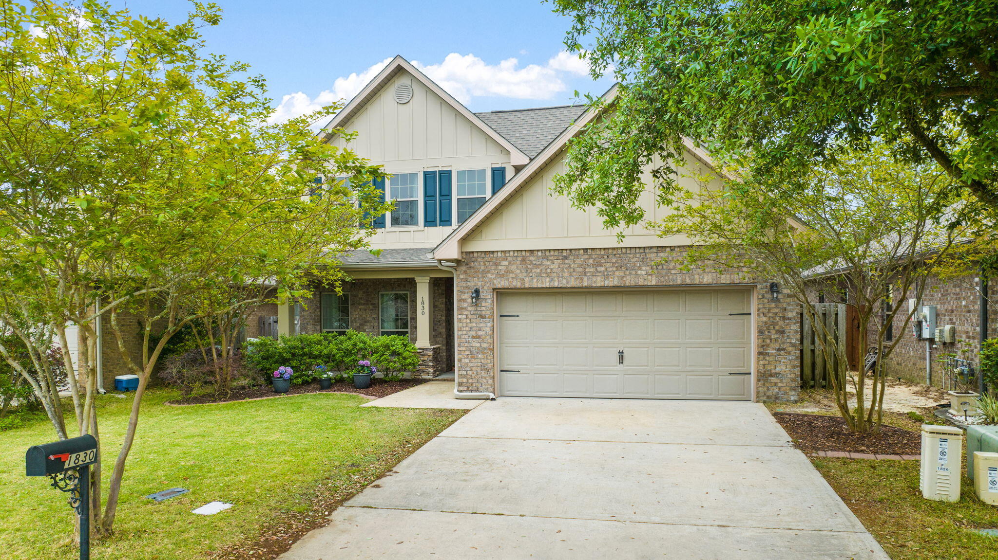 Great opportunity now available in popular Waterford Sound! Two-story,3 bedroom, 2 and a half bathroom brick home with an incredible bonus room upstairs! An open floor plan as you enter the home with LVP flooring in the living room and tile in the kitchen. Kitchen cabinets with staggered 42' uppers, granite countertops, all stainless appliances, subway tile backsplash and a custom island with additional storage cabinets and stunning white quartz. The primary bedroom has crown molding, carpet and a primary bathroom with a walk in closet, double granite vanities and ceramic tile flooring. Carpet on the stairs and in all bedrooms. Custom cabinetry in the laundry room and garage affording additional storage space.The backyard has a shady covered