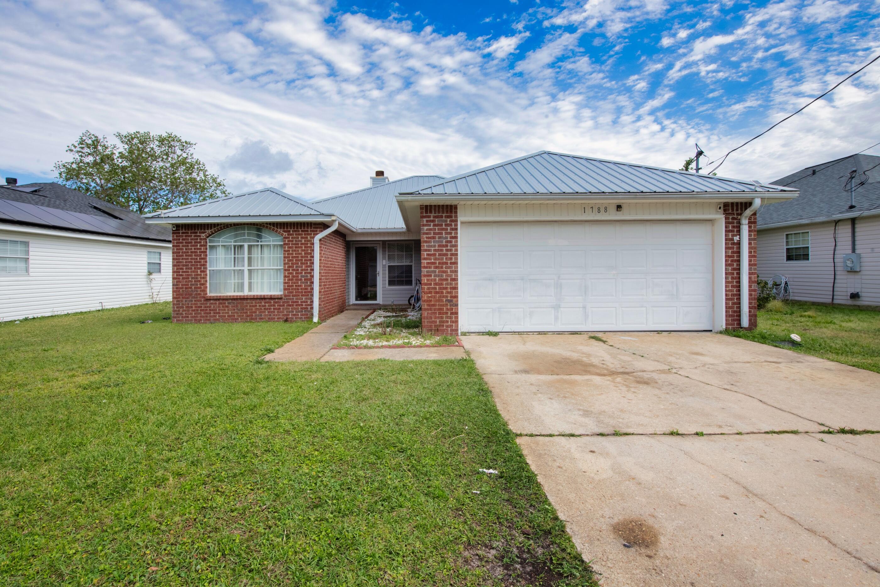 Welcome to this lovely home located in the heart of Fort Walton Beach! Situated in a desirable neighborhood, this well-maintained residence offers comfort, convenience, and plenty of upgrades.As you step inside, you'll immediately notice the spacious and inviting atmosphere. The living room features a stylish accent wall and a cozy fireplace, enhanced by upgraded trim for added elegance. Custom closets in two of the bedrooms provide ample storage space, while upgraded flooring in one bedroom adds a touch of luxury.