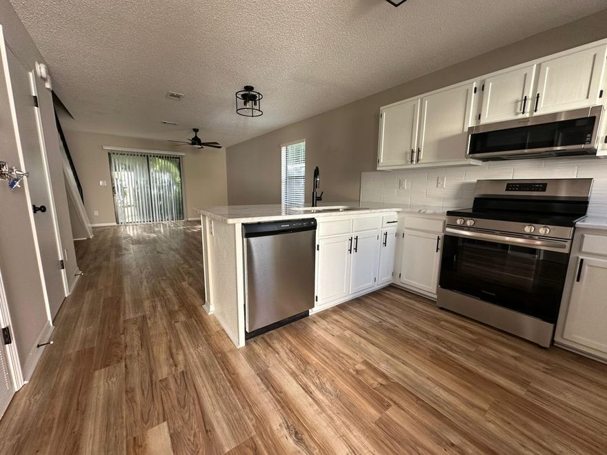 100% redone- Metal Roof , 2018 ac, 2025 Hot Water Heater,4 Pt being done Monday. This 2 bedroom, 1.5 bath town home  The end unit home features a bright open floor plan with new kitchen, granite, stainless appliances, new fans and lights, flooring, updated baths, new paint in and out, metal roof,     dining, living, and half bath downstairs with sliding doors leading outside and 2 bedrooms with full bath upstairs.  The location is convenient to military bases, schools, shopping, entertainment and the beautiful beaches of Fort Walton or Navarre.