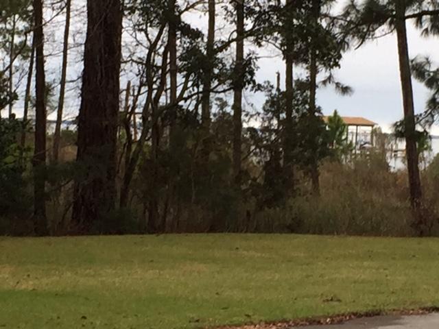 Excellent Waterview lot in Bluewater Bay .. several Beautiful Bayfront Homes across the street .. one of the few vacant lots available in Bluewater Bay .. there is no Association dues with this lot .. Short distance to the Golf Clubhouse and the full service Marina in Bluewater Bay ..