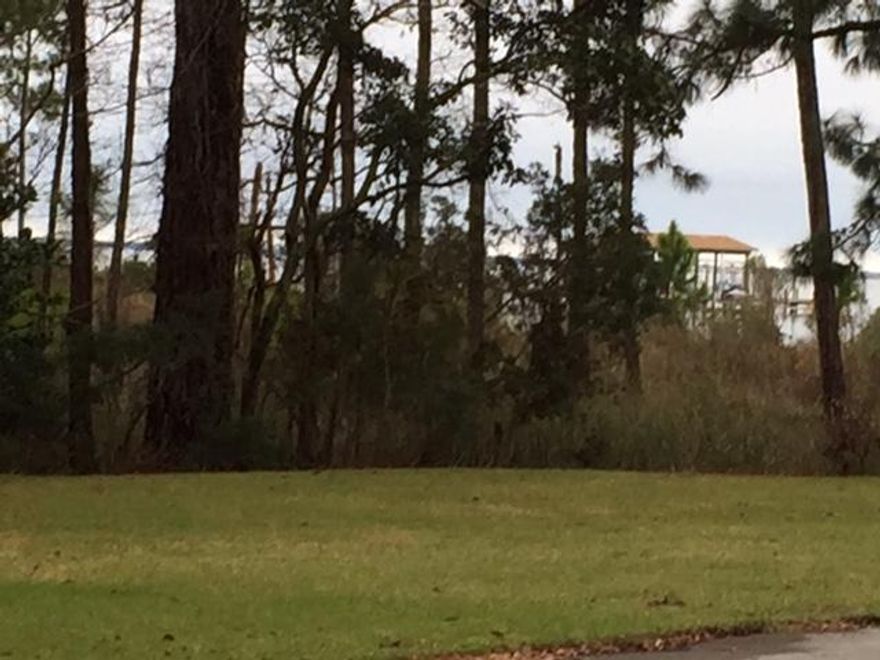 Excellent Waterview lot in Bluewater Bay .. several Beautiful Bayfront Homes across the street .. one of the few vacant lots available in Bluewater Bay .. there is no Association dues with this lot .. Short distance to the Golf Clubhouse and the full service Marina in Bluewater Bay ..