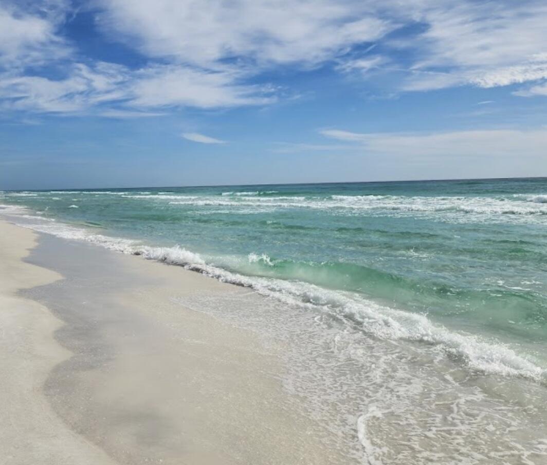 Build your dream home here! This is a rare lot south of 98 and within minutes of the Gulf and all 30A has to offer! A quick bike or golf cart ride away from Emerald Green waters and white sandy beaches! Multiple beach accesses and Santa Rosa Rosa Golf Club are just a few minutes away! Lot has access to city water, sewer, electric, and is in X flood zone (high and dry). Live the golf cart life!