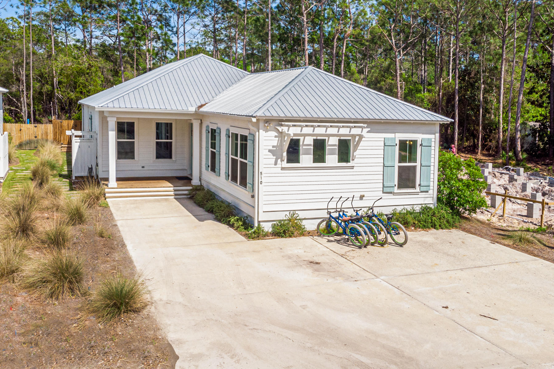 The ultimate one story 6 bedroom and 4.5 bath beach house located in Seagrove just off 30A. The San Juan Beach access is just a short .55 miles at end of the road The home features 10 foot ceilings throughout with 2 master suites with coastal decor making the ideal house for large families or groups as it easily accommodates 16. The open kitchen flows into sitting area leading to an outdoor oasis. The private back yard deck overlooks forest and boasts a heated dipping pool, fire pit, grill and plenty of space to spread out. This home was built in 2018 and has had 3 solid years of rental history. The location, layout, privacy makes this house wonderful for full time living, short term rental or true second home ownership. This neighborhood is a great mix of all three property owners.