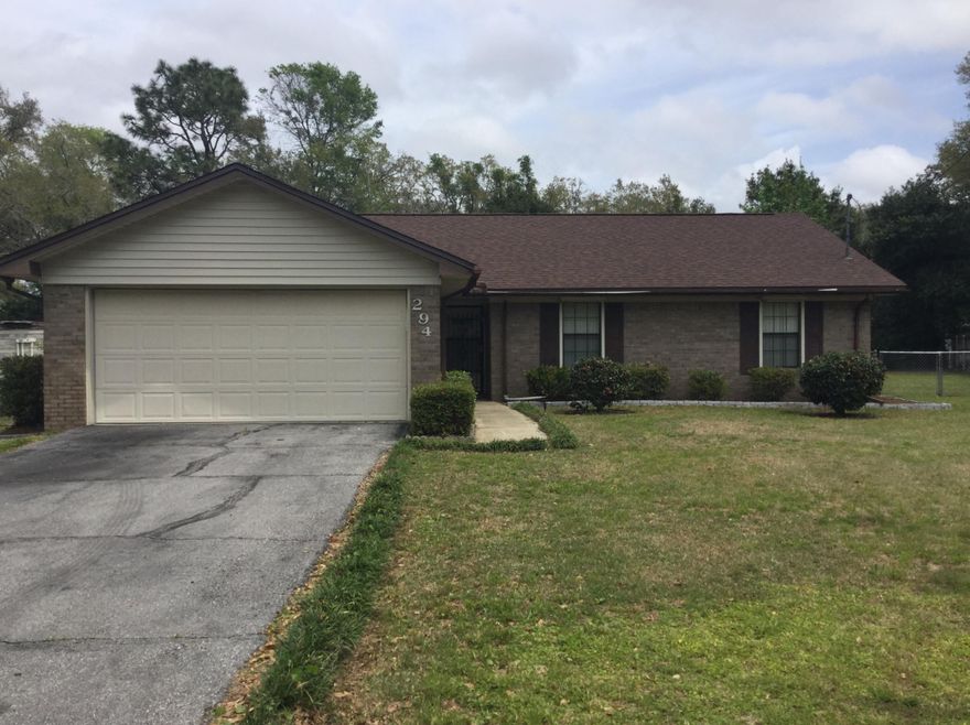 Just 2 miles from militarty base, and minutes from shopping, schools and restaurants. 3 bedroom~2 bath home with new paint and a desired floor-plan make this home a keeper for any family! Enter the house to a sunken living room that boasts an inviting, cozy brick fireplace and vaulted ceiling. The kitchen and dining room have two entrances allowing for easy inside traffic flow. Enjoy Florida's weather on the screen patio which opens to the spacious fenced back yard to include a large storage shed! Use it as a work shop, club house and/or garden center to fit all your tools, lawn mower and more! The exterior of this home include hurricane shutters on the windows and a new roof that's only a year old!Tote your paddle board, kayak,and/or fishing polls on a short walk to BoggyBayou