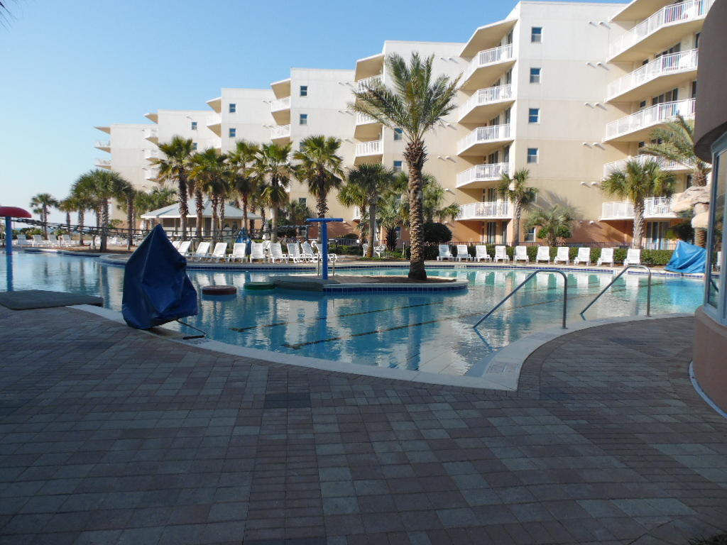 What a lovely 2 bedroom, 2.5 bath condo with an extra bunk room, that features views of the Gulf and balcony access from the master bedroom and the living room! The kitchen has stainless steel appliances, beautiful cabinets, tile flooring and granite countertops! Just bring your toothbrush! Waterscape amenities include 3 pools one which is heated and one for the kids with wading pool, an incredible Lay-Z River for relaxing, so close to the beach and all the Resort has to offer!