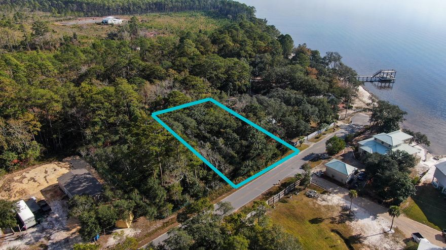 Almost 1/2 acre lot just steps to the bay! Opportunity to purchase the adjoining lot also (MLS 887070) for nearly an acre! Zoning is rural village with land use as rural residential. Level lot, backs up to Eglin property, ready for your new home or venture. The county GIS maps indicates no wetlands and is flood zone X. Owner does not have any wetland studies or survey. You won't find any buildable property this close to the water at this price point, so don't delay!