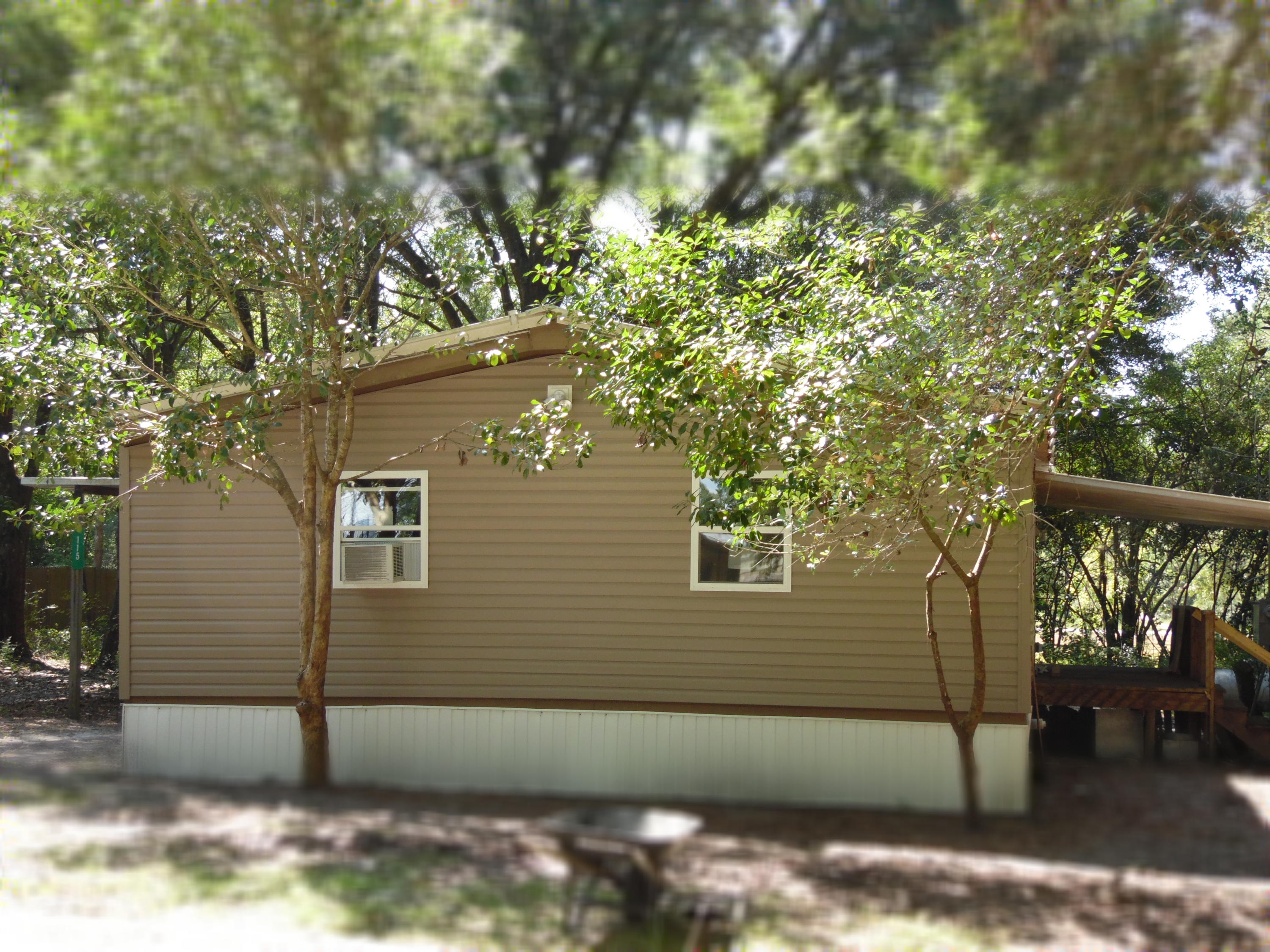 Seller has renovated home with new bathrooms, new kitchen, re-wired, new floor covering, new siding. There are covered front and back porches. This home is just a block away from the Juniper Lake Park which has a public boat ramp for some of the best fishing in the area. The lot has many trees for shade on those hot days. There is a breakfast bar 3 bedrooms and 2 full bathrooms.