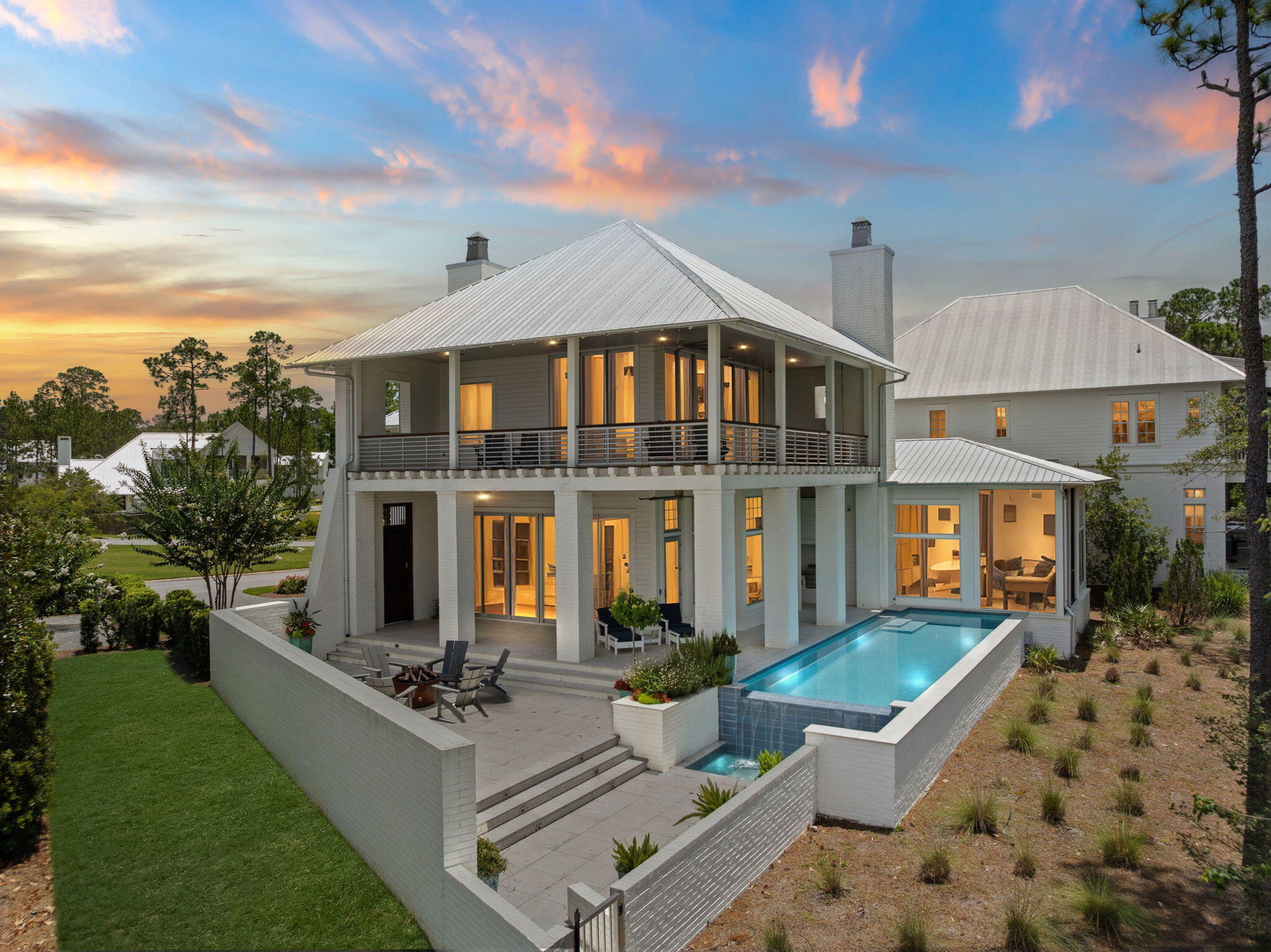 Introducing 15 Parish, a bold and sophisticated contemporary estate set along the protected shoreline of Choctawhatchee Bay in the prestigious gated community of Churchill Oaks. Designed with clean architectural lines, expansive glass, and open living spaces, this custom residence pairs modern luxury with timeless natural beauty.Set on one of the most coveted homesites in the community, 15 Parish enjoys uninterrupted views of the bay and direct adjacency to a conservation preserve, ensuring permanent privacy, open space, and sweeping vistas that will never be built on.The home features 4 bedrooms, 4.5 bathrooms, plus a bunk room, all crafted with thoughtful detail and livable elegance... The first-floor primary suite offers tranquil water views, outdoor access, and a spa-like bath retreat. Main living areas connect effortlessly to the outdoors, opening to expansive covered terraces that capture both sunrise and sunset light.
A standout feature is the private pool overlooking the preserve and the bay, offering a serene and elevated backdrop that transforms everyday living into a resort-style experience. Whether swimming, lounging, or dining alfresco, the outdoor living space is both private and breathtaking.
The detached carriage house includes a full kitchen and laundry, providing flexibility for guests or multi-generational living. A 50-foot private boat slip with lift is also included, placing open water access just steps from your front door.
Located within Churchill Oaks, South Walton's premier bayfront community, the home is surrounded by over 40 acres of preserved natural landscape, including trails, lakes, and centuries-old live oaks. With low-density planning, architectural continuity, and a focus on coastal elegance, Churchill Oaks offers a sense of peace and permanence rarely found on the Emerald Coast.
At the heart of the neighborhood is an 8,000-square-foot bayfront clubhouse, featuring three pools, fitness facilities, a catering kitchen, and a full-service marina. These amenities complement the relaxed luxury that defines the Churchill Oaks lifestyle.
15 Parish is more than a home. It is a modern coastal sanctuary, blending contemporary design with protected natural beauty and refined community amenities in one of Northwest Florida's most sought-after waterfront settings.