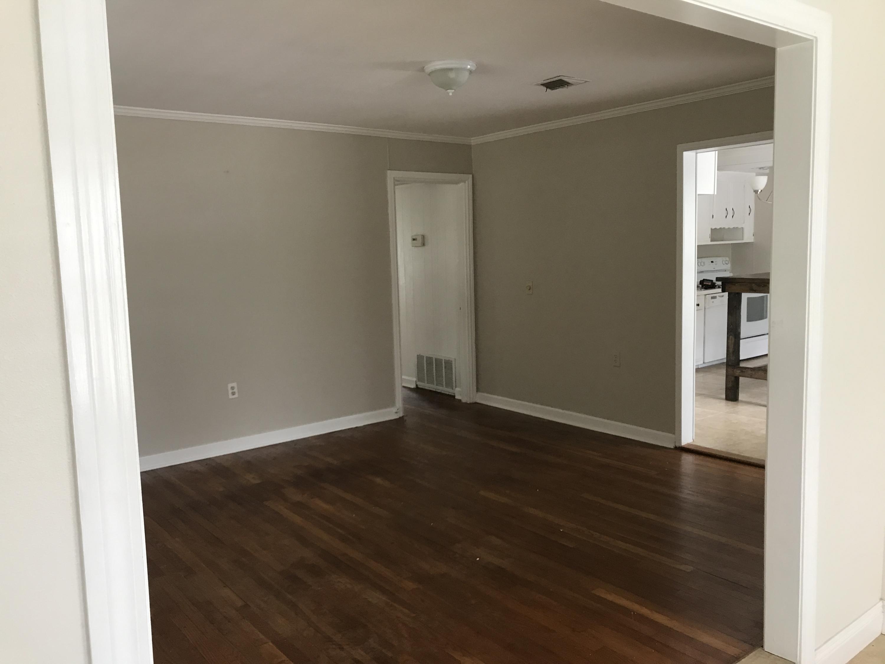 This home has it all ... original wood flooring throughout the living room and bedrooms of the original home ... and carpet in the Master suite addition over the 2 car garage.