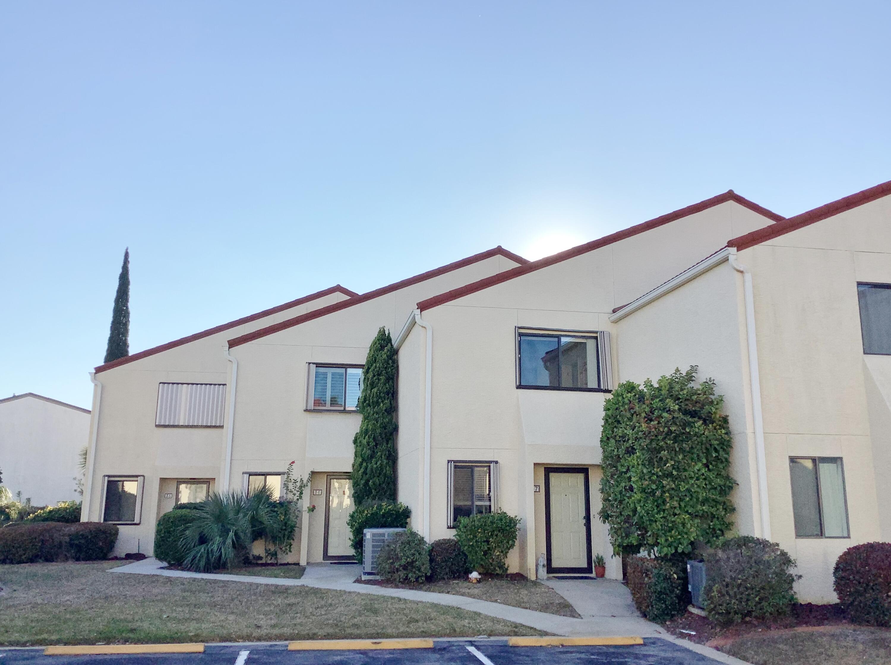 Much Sought after unit in gated, waterfront community of Clipper Cove. With only 39 owners, this intimate community enjoys private dock, kayak storage/car wash area, pool, and a private boardwalk to Santa Rosa Blvd, just across from Public Beach Access #1. Never on the market, this highly desired unit and floor plan has main living on the 1st level! Walk into the remodeled kitchen with stainless steel appliances, custom woodwork on cabinets, with Quartz counters, glass back splash, and custom wine motifs painted by local artist on breakfast bar, cupboards and shelves. Open Dining/Living areas extend to sliding glass doors out to palm tree painted, extended patio, and professionally landscaped, common area with a peak of the Sound. Master bdr has huge balcony with beautiful water views,