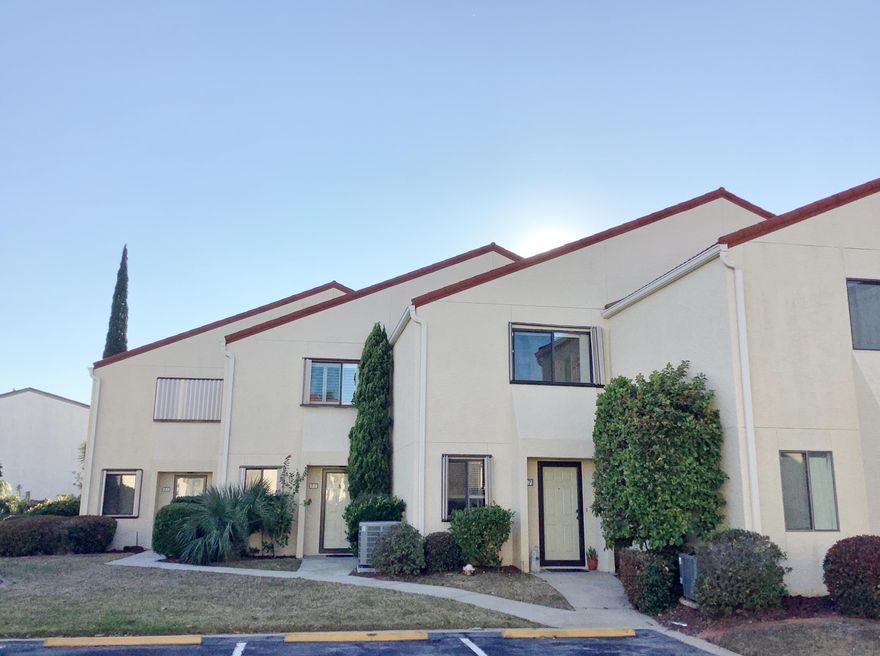 Much Sought after unit in gated, waterfront community of Clipper Cove. With only 39 owners, this intimate community enjoys private dock, kayak storage/car wash area, pool, and a private boardwalk to Santa Rosa Blvd, just across  from Public Beach Access #1. Never on the market, this highly desired unit and floor plan has main living on the 1st level! Walk into the remodeled kitchen with stainless steel appliances, custom woodwork on cabinets, with Quartz counters, glass back splash, and custom wine motifs painted by local artist on breakfast bar, cupboards and shelves. Open Dining/Living areas extend to sliding glass doors out to palm tree painted, extended patio, and professionally landscaped, common area with a peak of the Sound. Master bdr has huge balcony with beautiful water views,