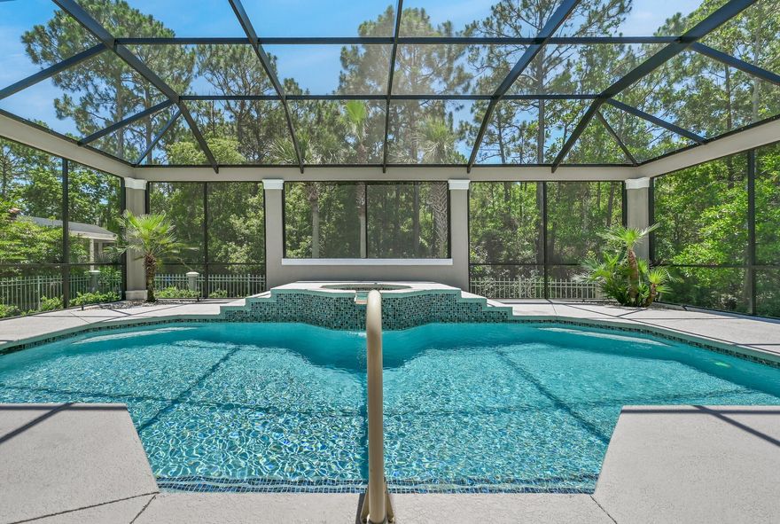 Welcome to 284 Corinthian Pl., located in the gated golf community of Regatta Bay! This beautiful, meticulously maintained home is located on a quiet cul-de-sac & backs up to a nature preserve. 284 Corinthian Pl. offers, 3 bedrooms, 3.5 baths, plus a large office. The home has a split floorplan with two separate living areas, 12ft. -14ft. tray ceilings (in formal living room, foyer, dining room, master suite & kitchen), quartz countertops, gourmet kitchen (stainless steel appliances, gas cooktop, double oven, warming drawer, 2 sinks, center island, breakfast bar & breakfast nook), laundry room w/ cabinetry, counterspace & sink, screened lanai, outdoor kitchen (cabinetry, grill, sink), & a newly replastered pool w/ waterfall hot tub and whole house generator. Click more for add details The large master suite offers a sitting area, views of the outdoor living space, private entry to pool and his & her walk-in closets. The spacious updated master bathroom offers, his & her vanities, painted cabinets, new tiled flooring, new large soaker tub, new large separate shower w/ top to bottom glass enclosure & decorative tiled walls & floors.