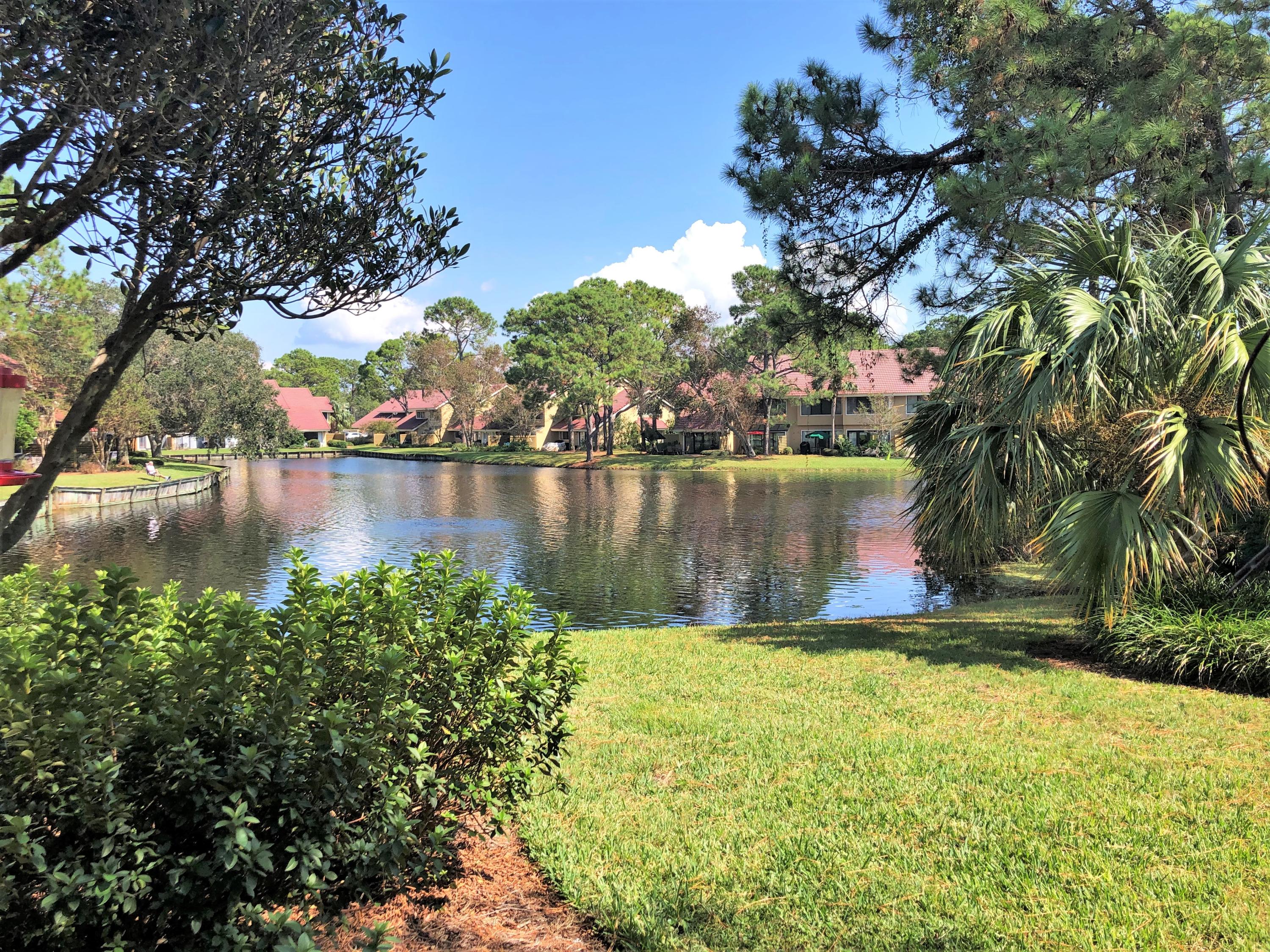 Beautiful Lakefront views and completely updated 2 bed, 2.5 bath townhome! Coretec engineered vinyl flooring through out. Updated, modern kitchen with granite counters, travertine back splash, and stainless appliances. Nicely furnished living room with sleeper sofa, flat screen TV, and dining table. Wet Bar and half bath with custom vanity on the first floor. The open layout of the kitchen, living, and dining area allows for tranquil lake views from every vantage point. Oak stair treads lead you to the second floor which offers 2 spacious bedrooms with king size beds and en suite baths. Both bathrooms have updated bathtubs, ceramic tile, and vanities with granite. Great Rental Income history.