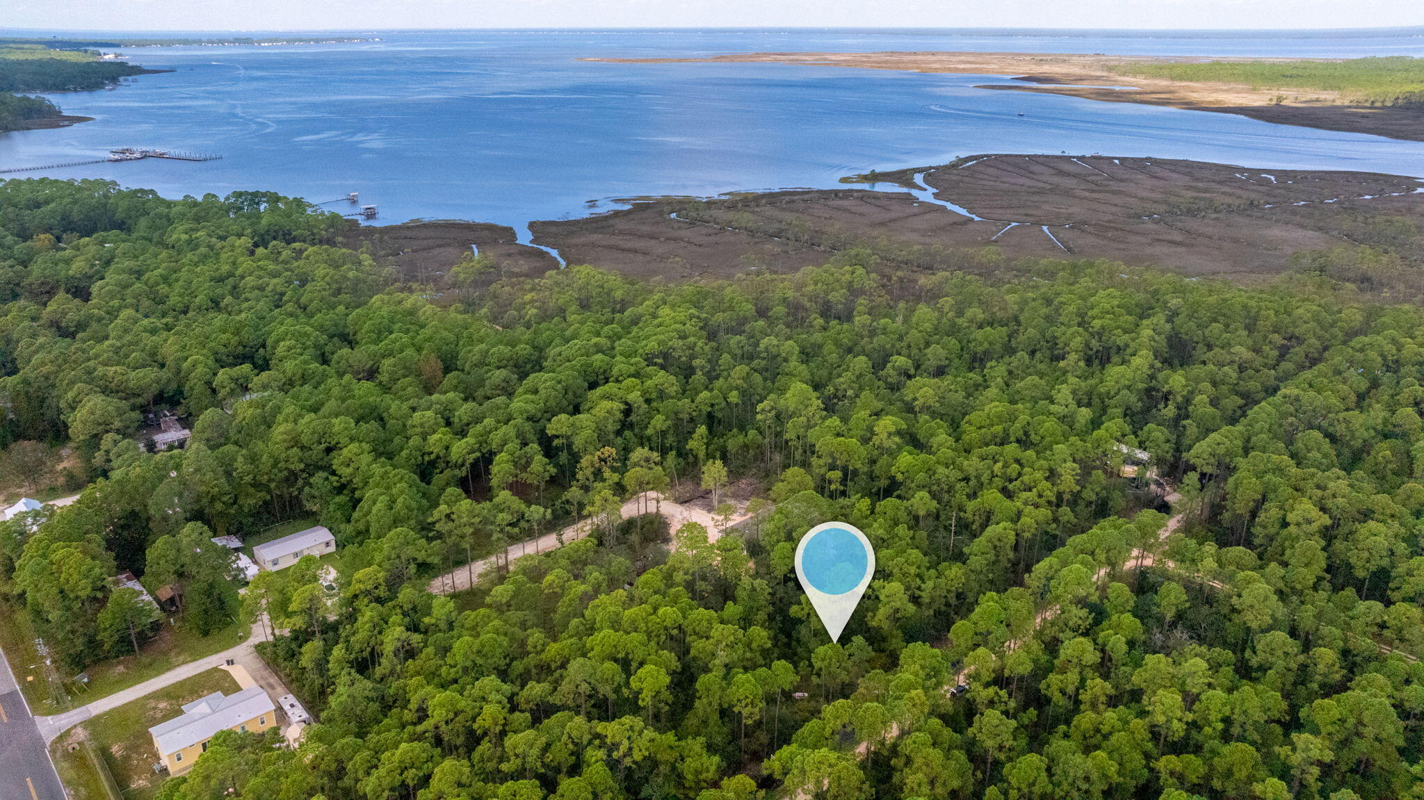 Santa Rosa Beach is a charming community that is growing and a perfect place to build your home on this .14 acre lot with NO HOA FEES and in a AE Flood Zone. The location is outstanding, only minutes away from Gulf Coast Beaches, entertainment, and great shopping. Also, a boat ramp to the bay is only a short distance away. This wooded lot has no utilities but already has a culvert in place. Enjoy the peace and quiet, surrounded by nature yet minutes from Highway 98 and the white sandy beaches of the Emerald Coast along County Highway 30A. Within a short drive to the 331 bridge and Choctawhatchee Bay. Explore local cuisine, enjoy boating or the world renowned golf courses that the Emerald Coast has to offer.