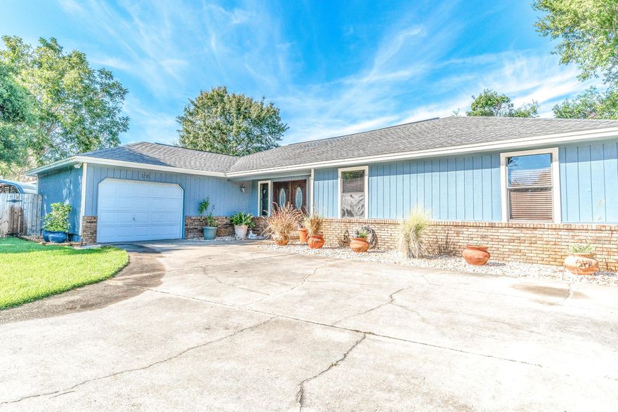 Location, price, large lot, and spacious interior  this 3-bedroom, 2-bathroom home in the heart of Destin has it all! Conveniently located off Airport Rd, this home is situated at the end of a quiet cul-de-sac. The double entry doors open to a foyer with two built in, hidden closets making clean-up a breeze! Directly behind the entry is the large living room with a stone feature wall with an inset for the included entertainment center with an electric fireplace. All of the bedrooms are located on the right side of the home with an office and kitchen to the left. The eat-in dining room is spacious features a custom, hand-made bar that fits neatly in the corner. A large enclosed Florida room overlooks the new pool, custom deck, open patio and large, shaded and fence back yard.