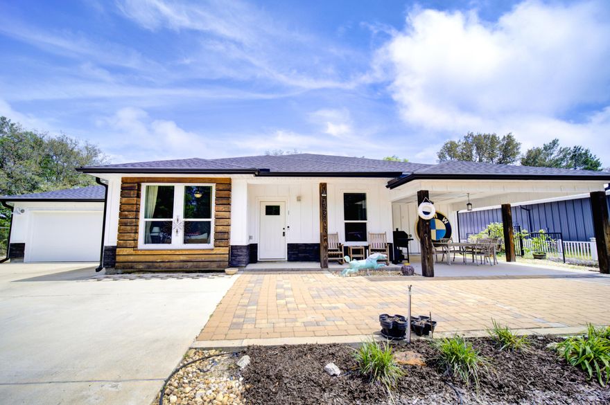 Beautiful open concept 2x6 construction home with high ceilings. Completed in 2021, this home offers luxury vinyl flooring, with carpet in the large master and spare bedroom. Master bathroom is equipped with double sinks, soaking tub, and separate shower. Back door off master suite opens to a covered porch area. The kitchen is beautifully equipped with 42' taupe cabinets, and granite countertops. Oversized parking area with attached 2 car garage. Come Relax on the large covered front patio great for entertaining. Property also comes with a Shed in the back yard.