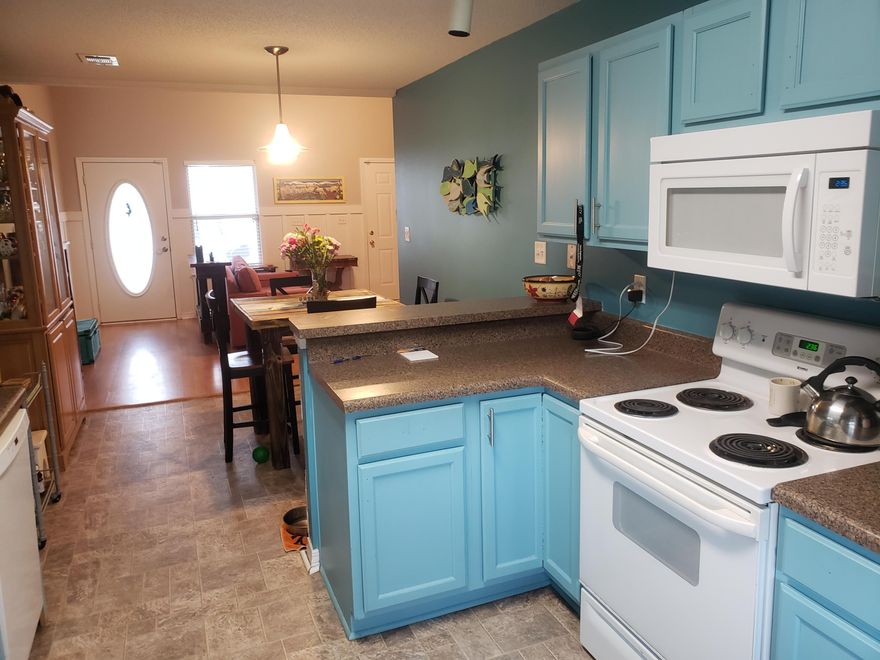 2 story attached town home with 1 car garage and fenced backyard in East Navarre. This unit has fresh new paint, all new carpet, new vinyl flooring in the kitchen, new AC and a new microwave. This unit features a fenced in back yard and one car garage. Close to Hurlburt Field, Beaches, and shopping.