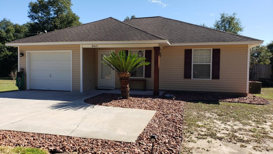 Immaculate and Open Floor Plan home on1/2 acre lot just 10 minutes from Milton. Three bedrooms, two baths with many upgrades. Ceiling fans in all rooms except for dining area. Kitchen has plenty of counter space, pantry, stainless appliances and laundry room. Kitchen and both bathrooms have tile flooring. Laminate Wood Flooring in Living Room and Dining Area. Storm doors on both front and back doors. Master bath features a 3.5 x 5 walk-in tiled shower with glass doors. Master bedroom offers a 8 x 4.5 ft walk-in closet. Large Back Yard with Privacy Fence. List of Upgrades upon request. Dimensions and measurements and all information believed to be correct but buyer to verify information deemed important.