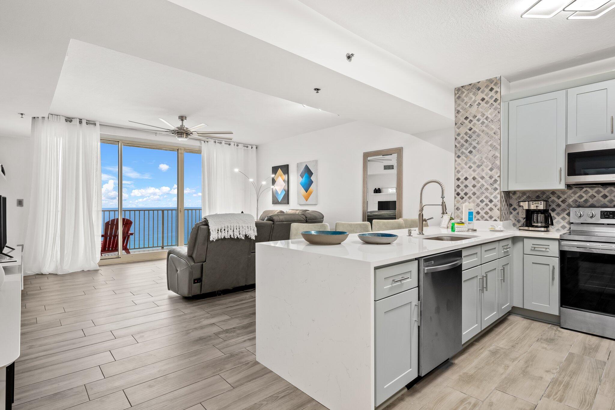 This PREMIUM C Plan is fully upgraded and updated. Highly desirable rarely available open concept C Plan offers a spacious living room and master en-suite with direct pool and GULF VIEWS from both, and a private bunk-room that can serve as a second bedroom. Additionally, two full baths make for wonderful ease of living. Relax by the pool or in the inviting living room or sip a cool drink out on the spacious oversized balcony and gaze at the pool and Gulf beyond. Enjoy welcoming, beautifully furnished spaces with new wood look flooring, upgraded lighting, new stainless appliances, new kitchen cabinets, new bathroom vanities, converted tub/ shower combos to glass door tiled showers. Private bunk room.