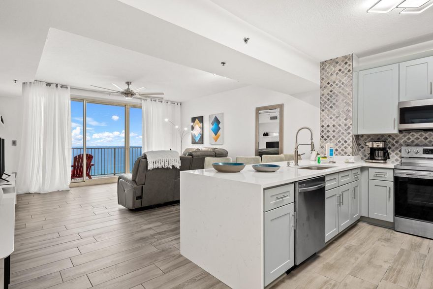 This PREMIUM C Plan is fully upgraded and updated. Highly desirable rarely available open concept C Plan offers a spacious living room and master en-suite with direct pool and GULF VIEWS from both, and a private bunk-room that can serve as a second bedroom. Additionally, two full baths make for wonderful ease of living. Relax by the pool or in the inviting living room or sip a cool drink out on the spacious oversized balcony and gaze at the pool and Gulf beyond. Enjoy welcoming, beautifully furnished spaces with new wood look flooring, upgraded lighting, new stainless appliances, new kitchen cabinets, new bathroom vanities, converted tub/ shower combos to glass door tiled showers. Private bunk room.