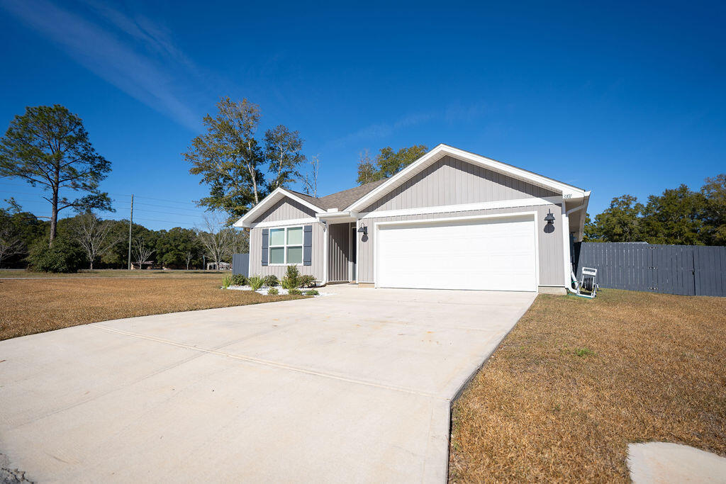 Welcome to your dream home! Built in 2023, this 1,272 sq. ft. gem offers modern finishes and thoughtful design in the Auburn area of Crestview, Florida.Step into the open-concept living space, featuring durable luxury vinyl plank (LVP) flooring throughout the common areas and bathrooms, providing both style and functionality. The cozy carpeted bedrooms, which feature walk in closets, offer comfort and warmth, perfect for relaxing at the end of the day.The kitchen is a chef's delight, boasting granite countertops, stainless steel appliances, and shaker cabinets for a timeless look. Whether you're preparing meals or entertaining guests, this space will impress!The master suite is a private retreat, complete with a spacious walk-in closet and an en-suite bathroom featuring... a double vanity for added convenience.  Two additional bedrooms and a second full bathroom provide plenty of space for family, guests, or a home office.

Step outside to enjoy the fully fenced backyard, offering both privacy and security. A metal carport provides additional storage or parking options, making this home as practical as it is beautiful.

Conveniently located in a peaceful neighborhood with easy access to local amenities, schools, and more, this home is perfect for first-time buyers, families, or anyone looking to settle in a growing community.

Schedule your showing today and experience the charm of this brand-new home for yourself!