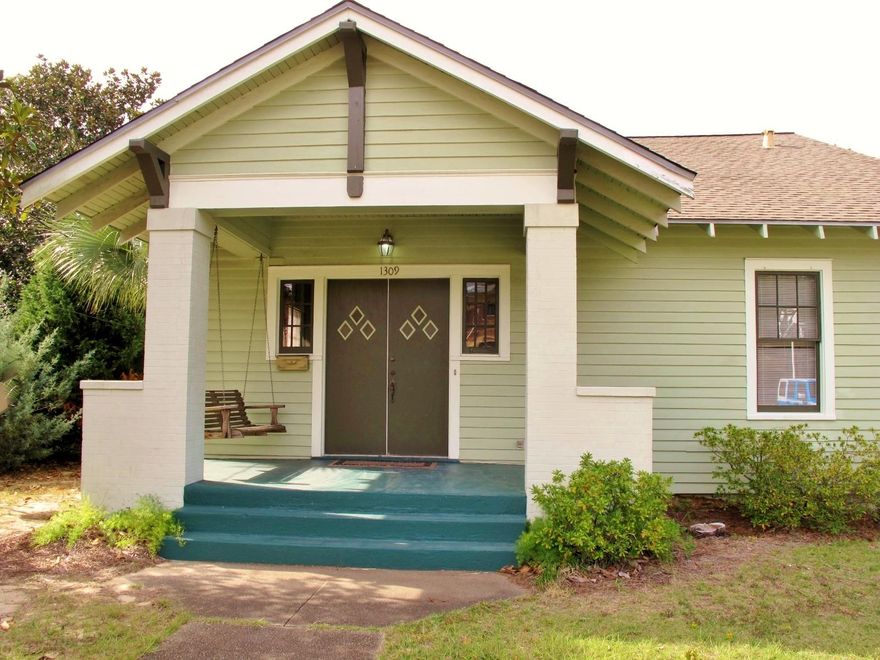 Classic East Hill Craftsman with many original features intact. Lovely spacious front porch with double doors and porch swing greets you. Three tone exterior paint color. 2004 roof. 2009 Tankless gas hot water heater. 2013 AC/Heat pump. Gorgeous gleaming wood floors throughout the entire home - cypress in the living and dining room and heart pine in the rest of the house as is customary with the homes of this era. Soaring 9 1/2 foot high ceilings. Original solid wood doors with original hardware, wide baseboard moldings and crown molding, chair rail. Spacious rooms -bedrooms are very ample for a Craftsman home. Period light fixtures. Tile floors in the baths, and claw foot tub. Kitchen has its original hardwood cabinetry with tile countertop and under-mounted cast iron sink for those who