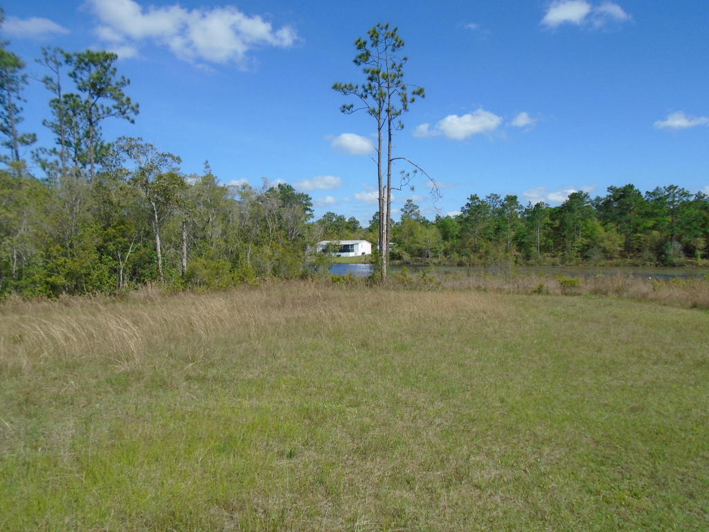 Beautiful waterfront lot in Oakwood Lake Estates. Seller has already cleared so the hard work is done. Paved Road frontage. Public Water is available. Excellent location just outside of the City Limits. Owner Financing with 20% down, terms negotiable.