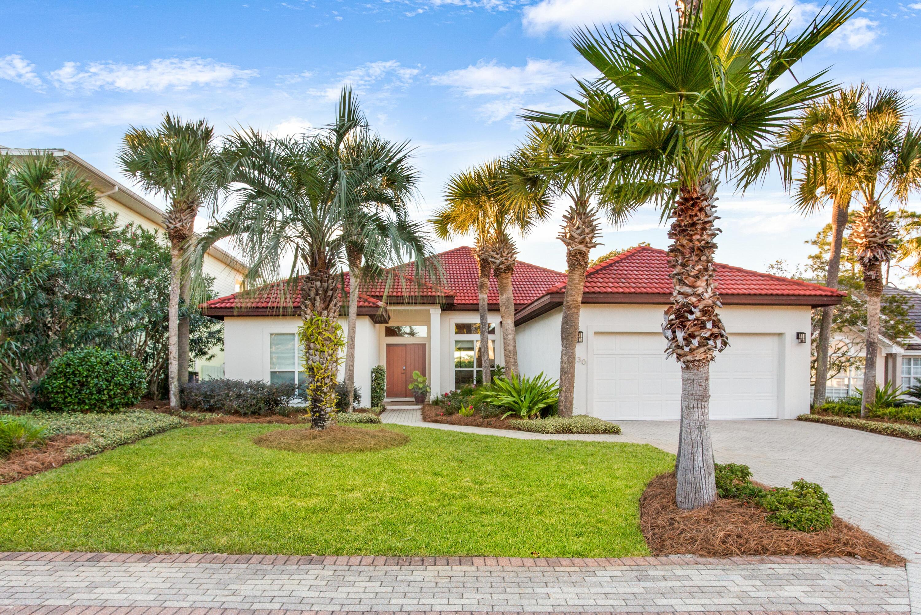 Completely transformed and renovated in 2019, this single-story home in Destiny (West) is a true coastal gem. Enjoy your private backyard oasis with a brand new heated pool and spa, along with a covered pavilion perfect for entertaining. Mesmerizing lake and sunset views enhance the serene atmosphere. Turn-key and fully furnished, this home includes a golf cart, charger, and a TESLA charging station. The open floor plan features elegant wood flooring throughout, complemented by designer tile in the guest baths. New 2019 HVACs. Top-of-the-line finishes include shiplap accent walls, Quartzite countertops, copper hardware, stainless steel appliances, a kitchen island, and spa-like bathrooms. The living area extends to a bright and cheerful Florida Room, opening onto the new pool and patio. Experience the vibrant, gated golf cart community featuring tennis courts, a fitness center, and recreation areas. Prime location - beach parking is just outside the gated entrance at Crab Trap, complete with pavilions, a beach bar, playsets, and lifeguards.