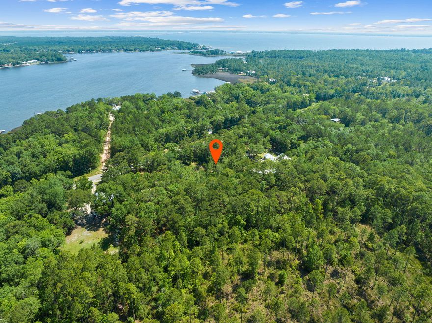 One acre on Bay Loop East in Freeport. No HOA. Wooded and minutes to all the amenities, boat launches and fishing Freeport has to offer. Great for family home, with extra room for big garage and storage for toys like boats, wave runners or RV. Lots like this are hard to find in Freeport. All public utilities are available along main county road.