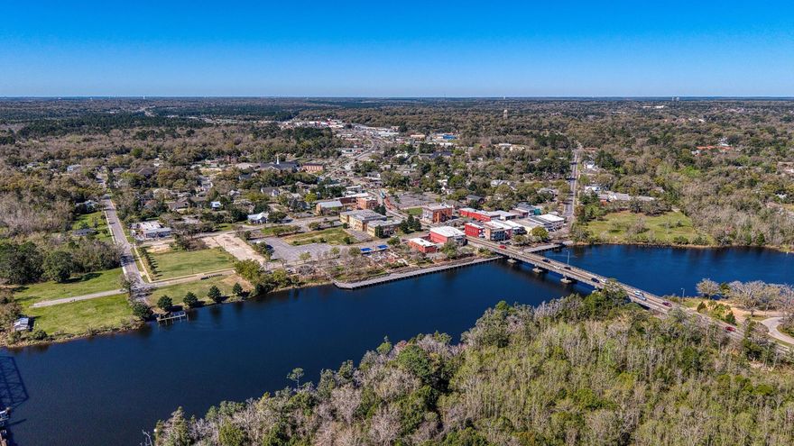 Rare waterfront opportunity offering 200 feet of deep-water frontage, ideal for boating, fishing, kayaking, and swimming--right from your backyard. This unique property features a licensed marina with 15 slips and significant potential for expansion, making it an excellent opportunity for investors or owner-operators looking to generate additional income.With vision and a little TLC, the possibilities are wide open: expand the marina, add additional slips, or explore future waterfront business opportunities.The 1,357-square-foot home provides comfortable living with flexibility for an owner, on-site manager, or potential rental income.  The property also includes a 380 square foot enclosed patio and a 200 square foot workshop, adding functional space for storage, hobbies, or marina operations. Located just 3 minutes from Downtown Milton, 34 minutes to Downtown Pensacola, 44 minutes to Pensacola Beach, and 48 minutes to NAS Pensacola, this property offers a rare combination of waterfront lifestyle, business potential, and convenient access to the Gulf Coast. Enjoy the marina lifestyle while creating income and building something special on the water. Opportunities like this are hard to find in this area.