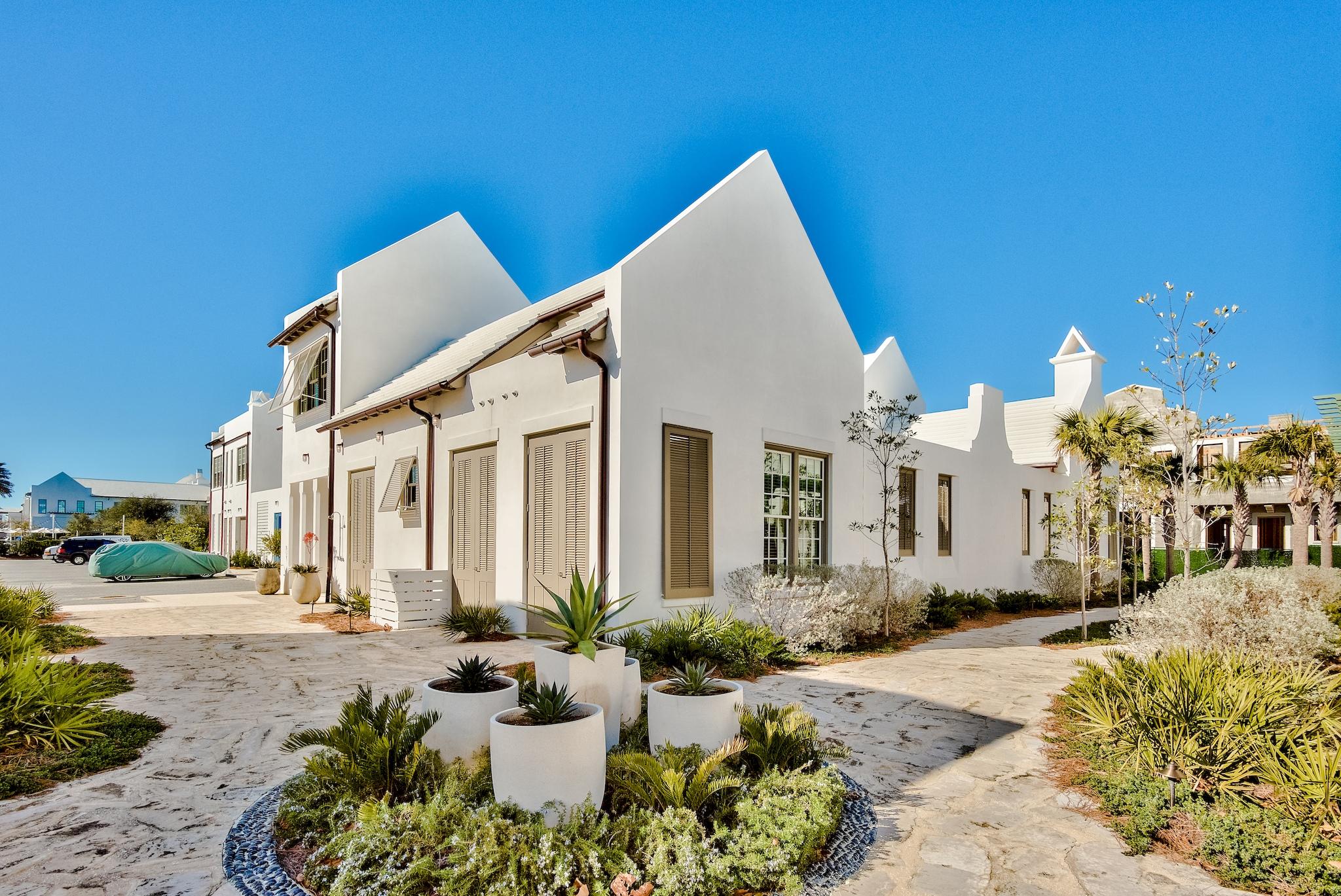 55 Fonville is one of the most exquisite homes in Alys Beach. This home was eloquently designed by Domin Bock Architects and built by Galvas Construction. Uniquely tucked as the end home in the Fonville Court enclave, this home is surrounded on three sides by beautifully landscaped pedestrian paths. This sprawling home leaves nothing to the imagination. Upon entering you are greeted with a vantage point through the home. With 4 bedrooms, 4.5 baths this home was curated perfectly for the idyllic Alys lifestyle. The home is accented with pompeii quartzite, custom cabinetry from keystone Millworks out of Atlanta, bespoke artisanal bronze powder room clam sink by Julie Wawirka, Venetian plaster, unique Q-tile, white washed pecky cypress beams, oaks floors, and polish shell stone throughout the first floor. One of the most incredibly unique characteristics of this home is the lush overstated courtyard that spans almost the entire width and depth of the home. The courtyard boasts a large covered living room with fireplace, dining area, and additional covered seating. The pool features custom tile and water feature truly leaving you feeling as though you are in a five star resort spa. This home has it all!