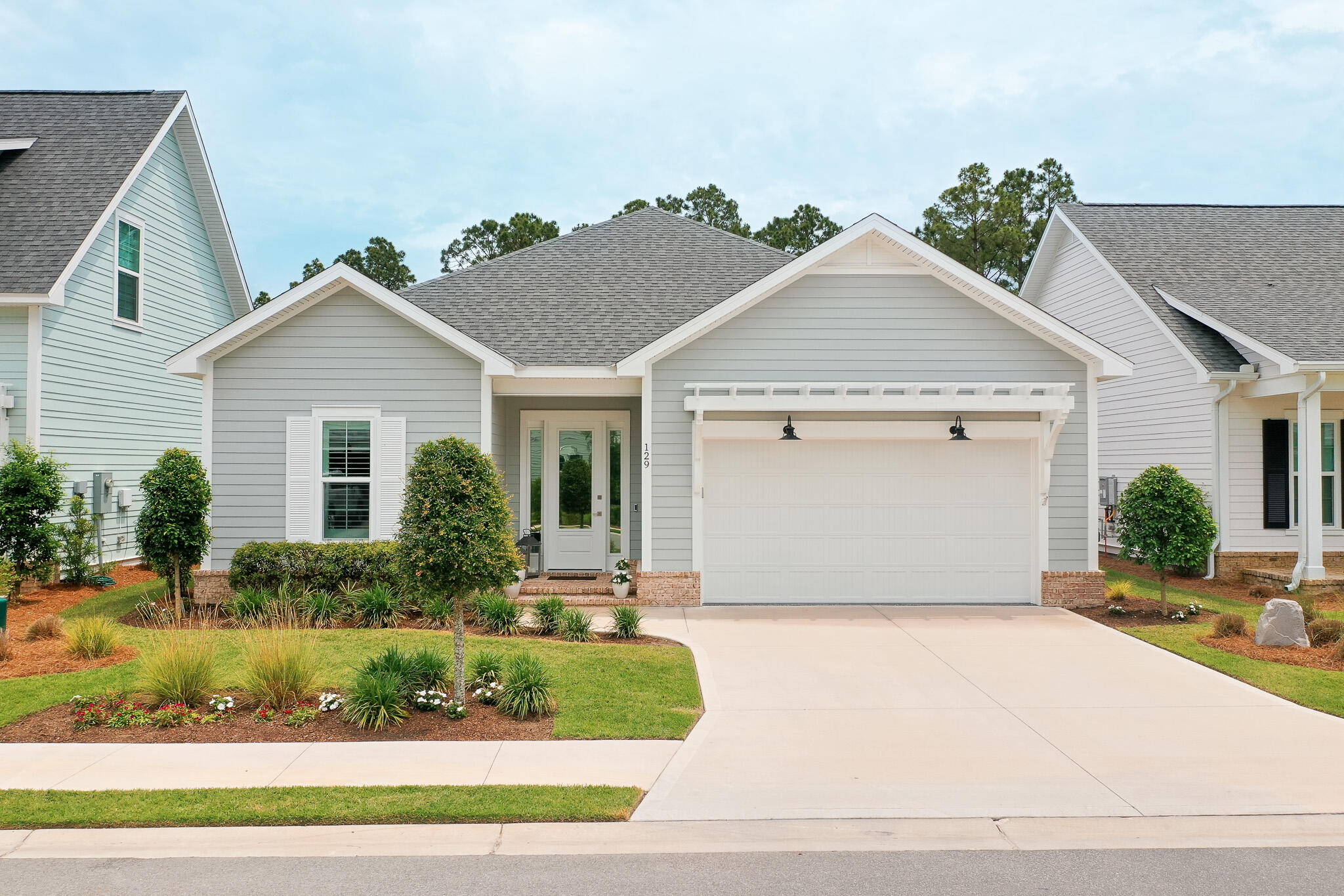 Welcome to 129 Suwannee Drive, a beautifully appointed single-story residence located in the desirable community of Watersound Origins in Inlet Beach, Florida. This exceptional property offers 1,871 square feet of thoughtfully designed living space, featuring four bedrooms and two and a half bathrooms. Perfectly situated within a ten-minute drive to the stunning 30A beaches, this home provides both convenience and tranquility in a wonderful family neighborhood. Upon entering, you are greeted by an inviting living room, complete with built-in bookcases and a cozy fireplace, creating a warm and welcoming atmosphere. The home is adorned with luxury flooring throughout, complemented by crown molding and recessed lighting, which enhances the elegant aesthetic. The abundance of natural light is accentuated by plantation shutters and window shades, ensuring a bright and airy ambiance.
The kitchen is a chef's delight, featuring quartz countertops, a gas range, and a wine fridge, all framed by wood cabinetry with soft-close functionality. The tiled bathrooms offer modern sophistication, with the master suite boasting a luxurious en-suite bathroom. The Jack and Jill bathroom serves the additional bedrooms, providing convenience and privacy.
Additional amenities include an epoxy-floored garage, a laundry room with a sink, and an extended back patio ideal for outdoor entertaining. The fourth bedroom is perfect for remote work or study, offering flexibility to suit your lifestyle needs.
The property is beautifully landscaped, enhancing its curb appeal and providing a serene outdoor environment. Many upgraded features throughout the home ensure a comfortable and stylish living experience.
This residence is an exceptional opportunity for those seeking a harmonious blend of luxury and location. Experience the best of Inlet Beach living in this meticulously maintained home. Schedule your private showing today and discover the unparalleled charm of 129 Suwannee Drive.