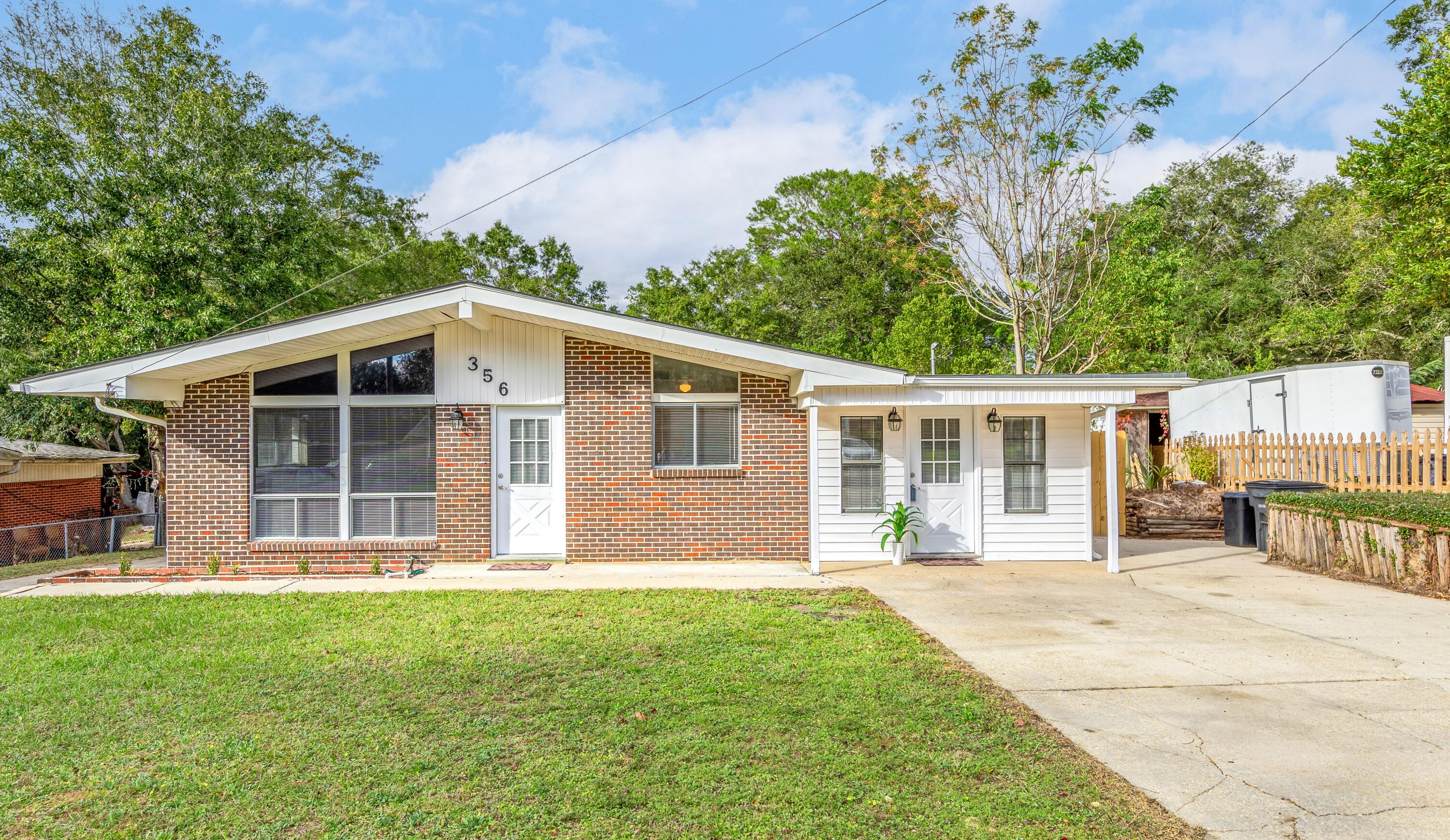 This move-in ready home is just 10 minutes from Eglin AFB, less than 2 miles from local boat docks, fishing piers, parks, and a short drive to the beaches. You'll enjoy the large, fenced yard and back patio with plenty of parking spaces for your RV, boat, or up to 10 cars on this property! All bedrooms and living areas have beautiful, laminate wood-like flooring, freshly painted throughout, and a spacious utility/laundry room not included with square footage. Bonus room to include a built-in bookshelf, great for sitting area or additional office/formal dining room, the options are limitless!